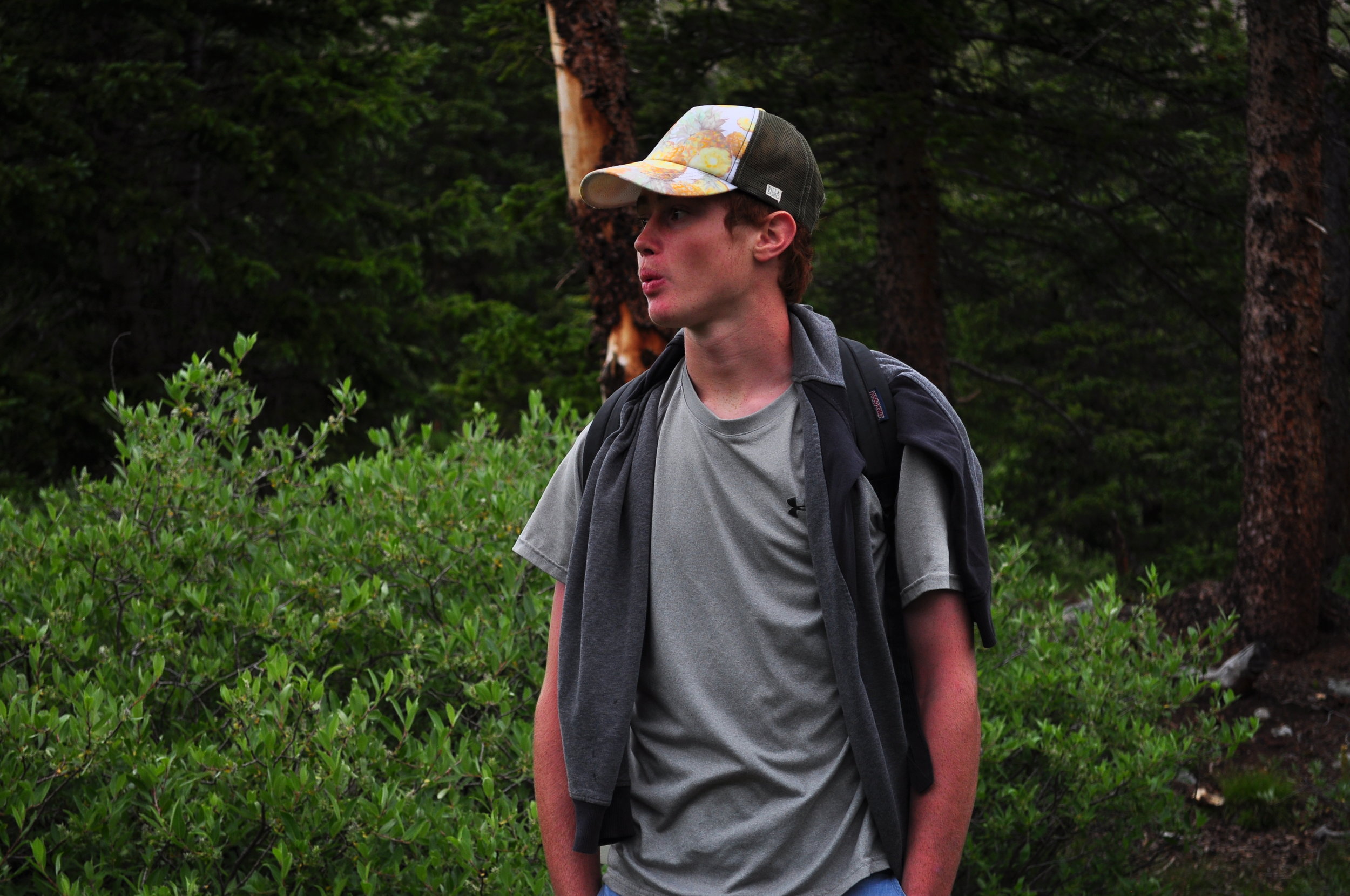  Evan Place whistles as he hikes up a mountain in Buena Vista.&nbsp; 