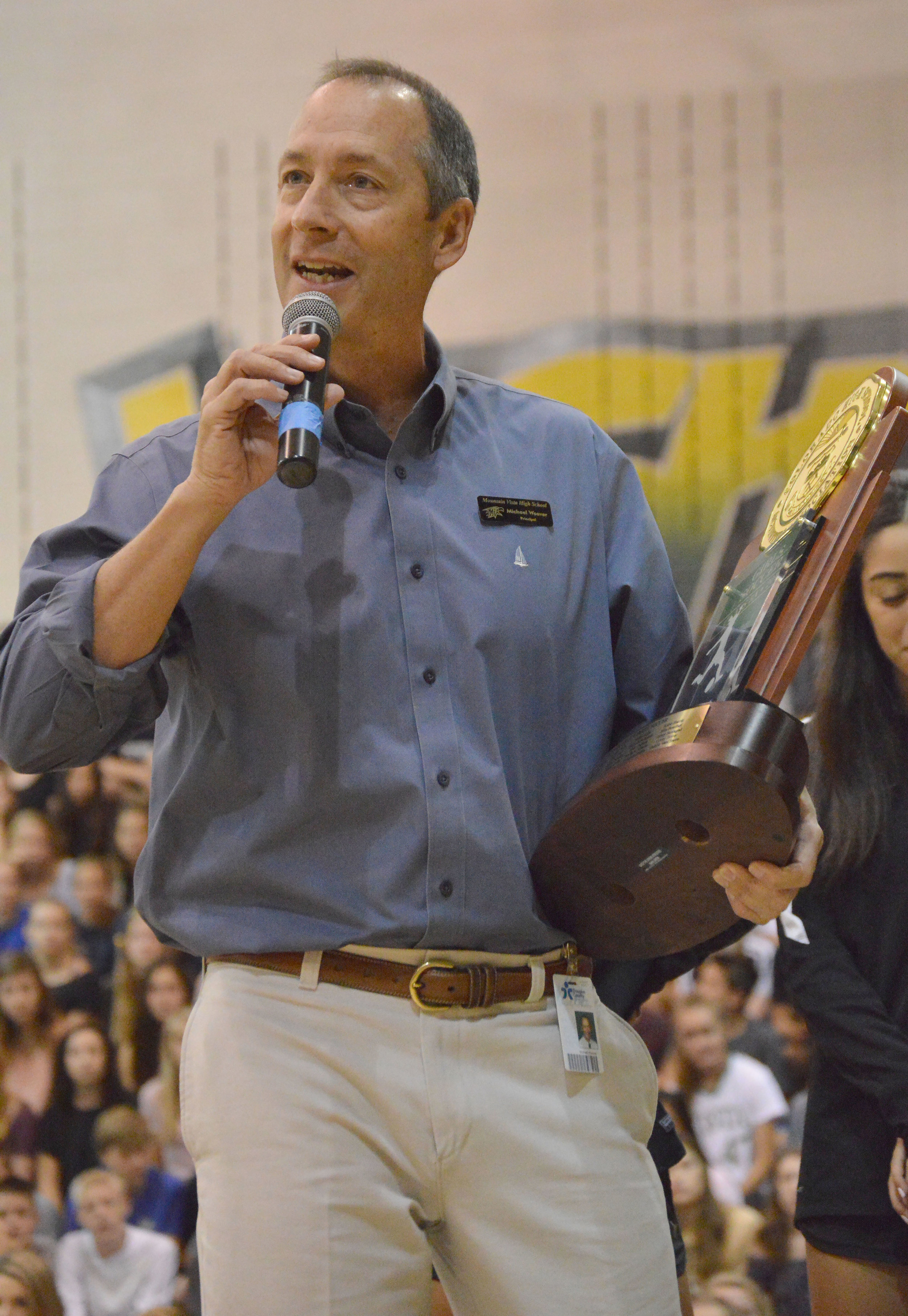  Principal Michael Weaver speaks at the homecoming assembly awarding the women's varsity soccer team the 5A State Champion's title.&nbsp; 