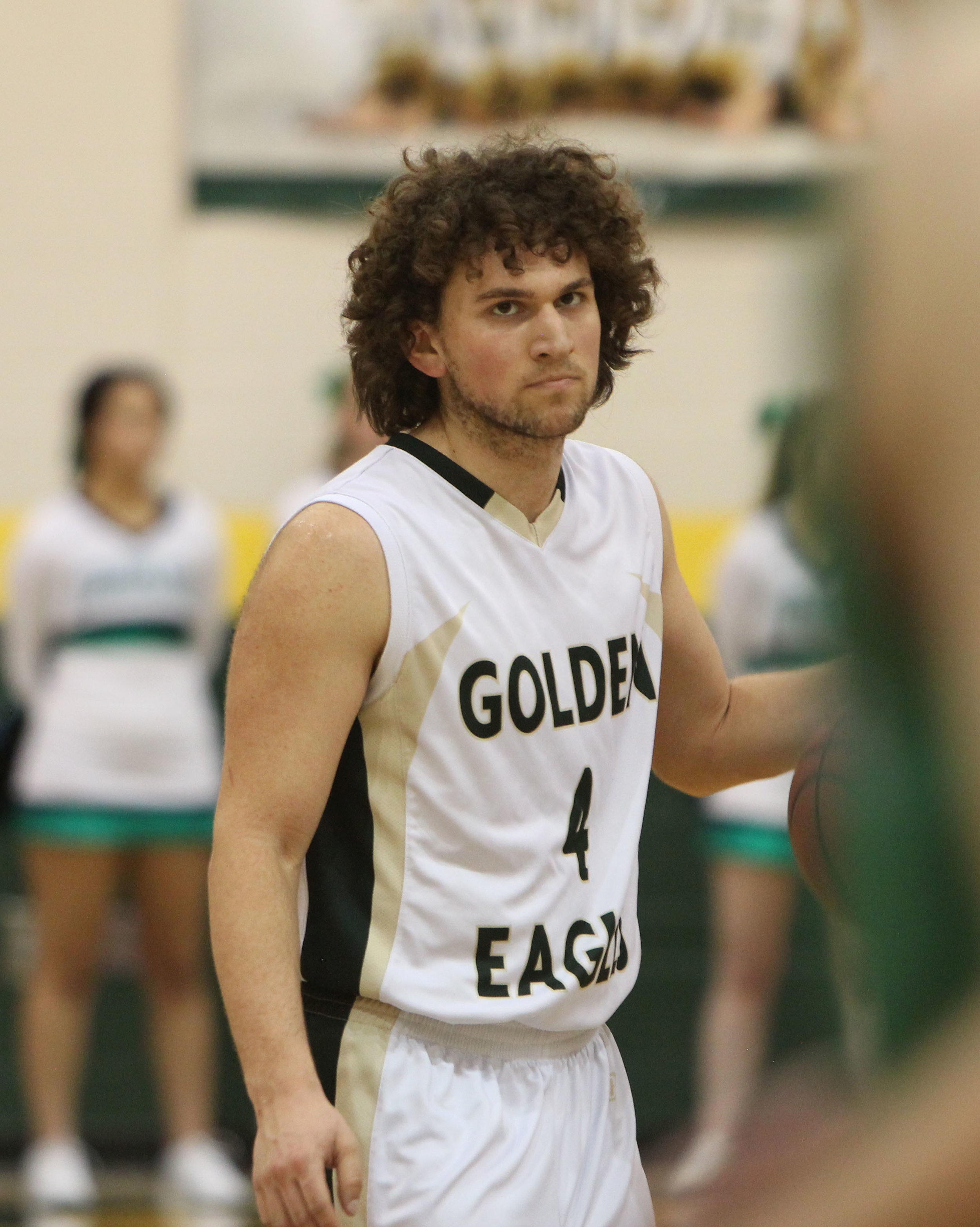 Junior JJ Fisch stares down his opponent in the rivalry JV basketball game. 
