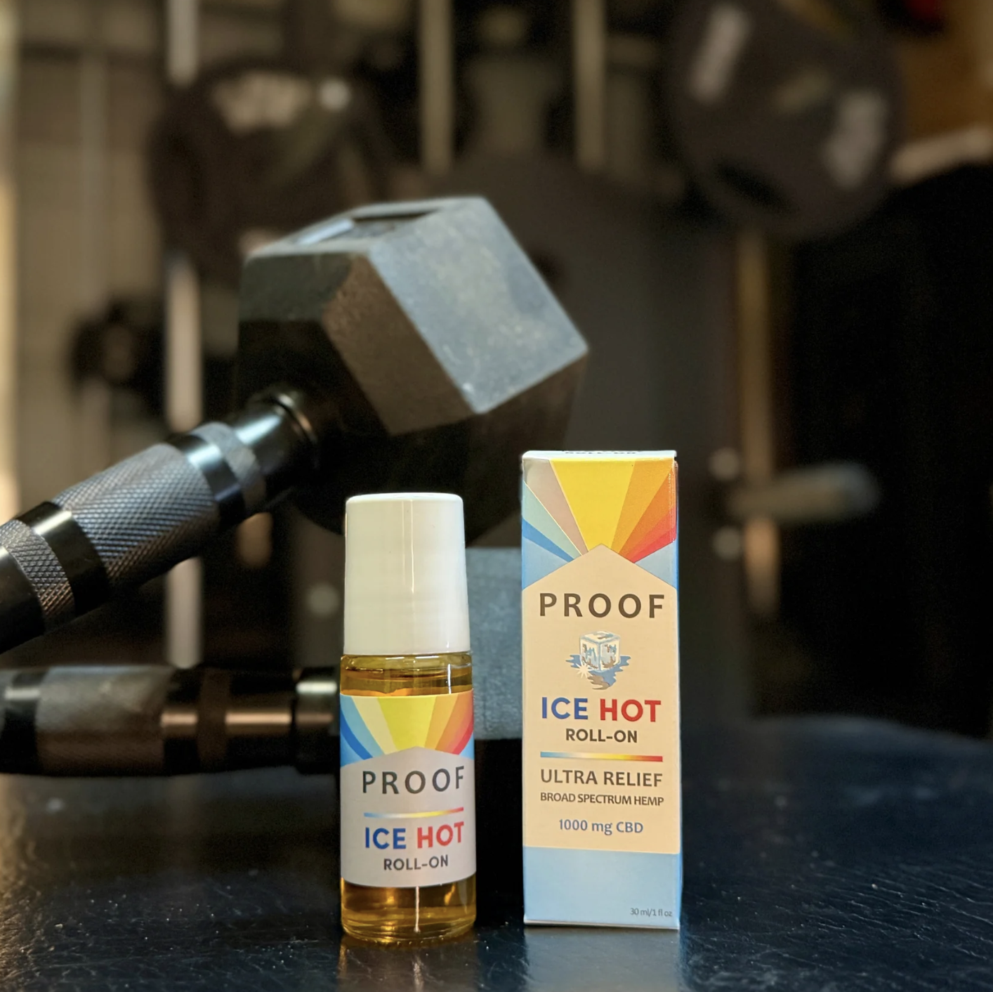 Proof Remedy CBD Ice Hot Roll-on for muscle recovery in a gym with weights