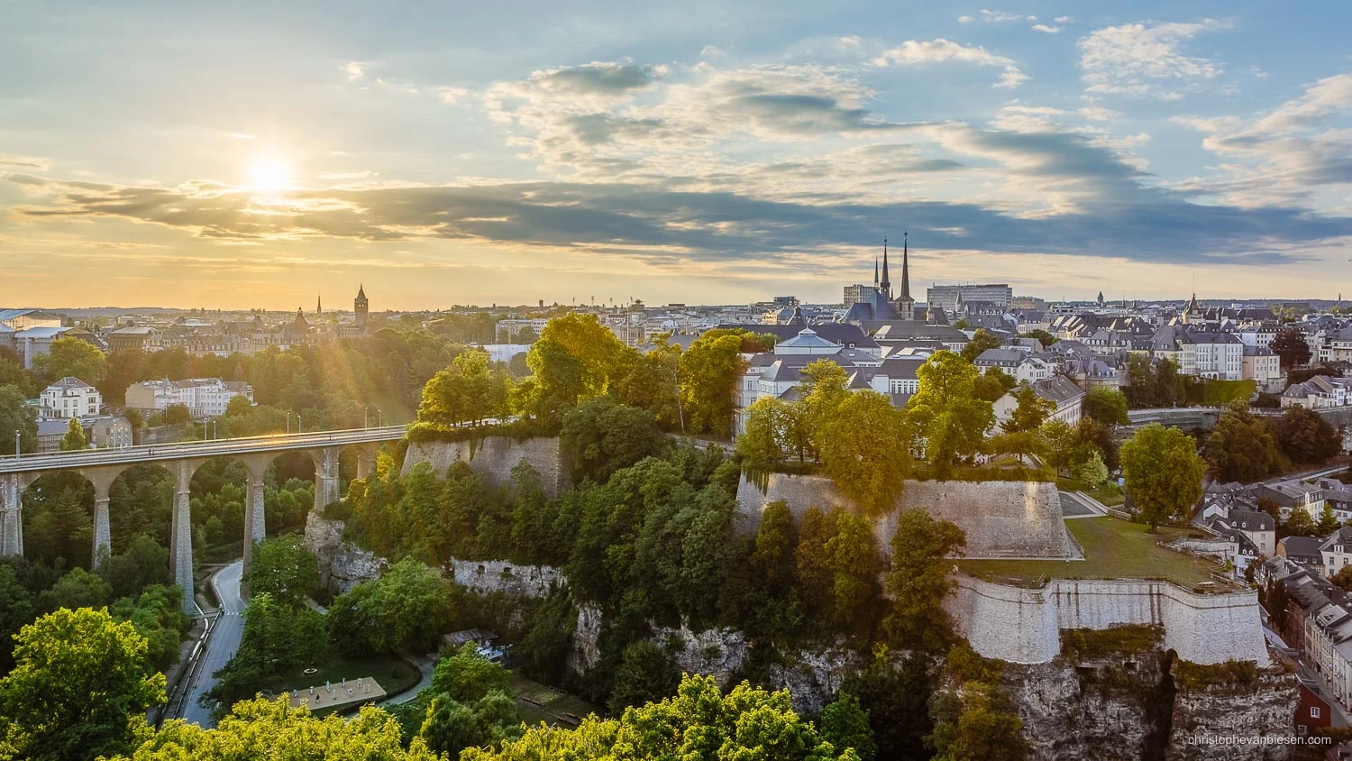 Sunset over Luxembourg City's Corniche with the roofs of Notre-Dame and the BCEE tower in the distance