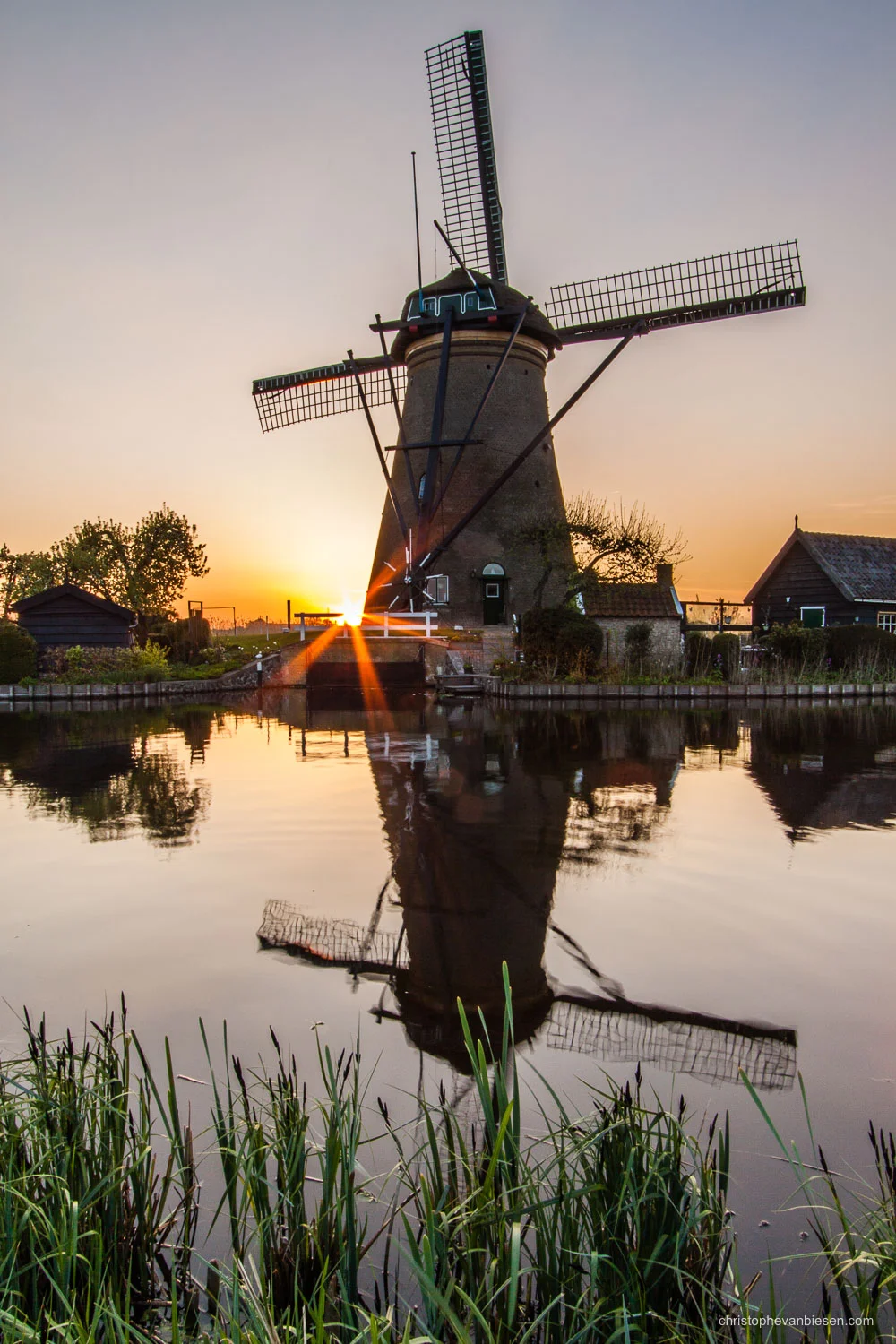 Kinderdijk - The Netherlands - Sunset in the Netherlands with one of the famous Dutch windmills of Kinderdijk