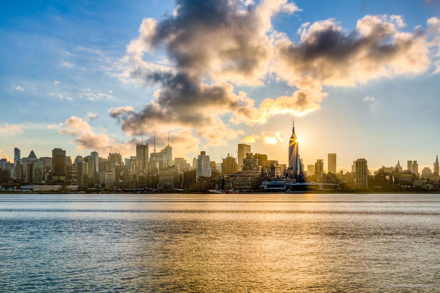 New York - United States - Sunrise over Manhattan with the Sun appearing in just the right spot behind the Empire State Building