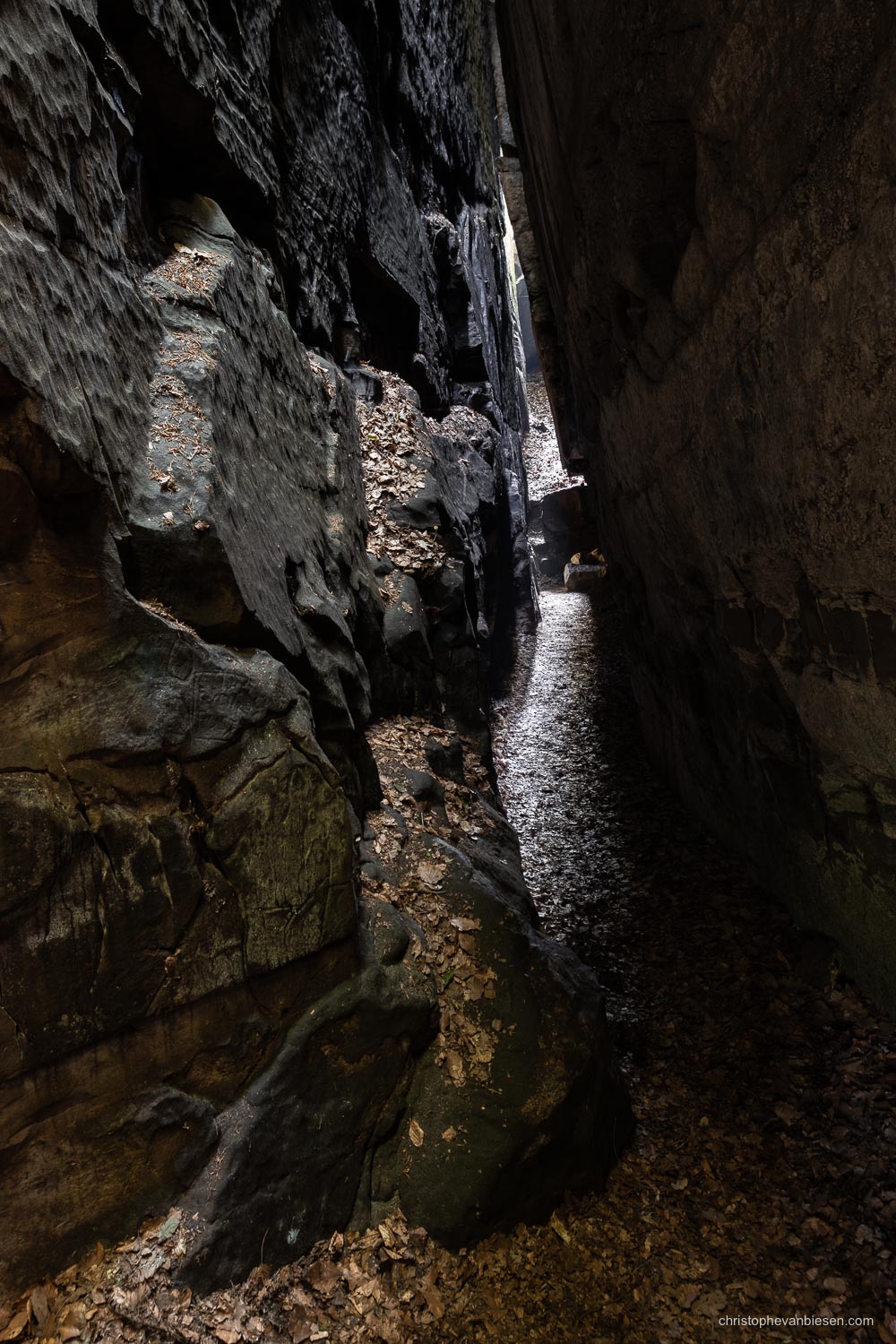 Visit the Mullerthal - Luxembourg - Narrow and dark passages in the Mullerthal Goldfralay caverns - A Light in the Dark