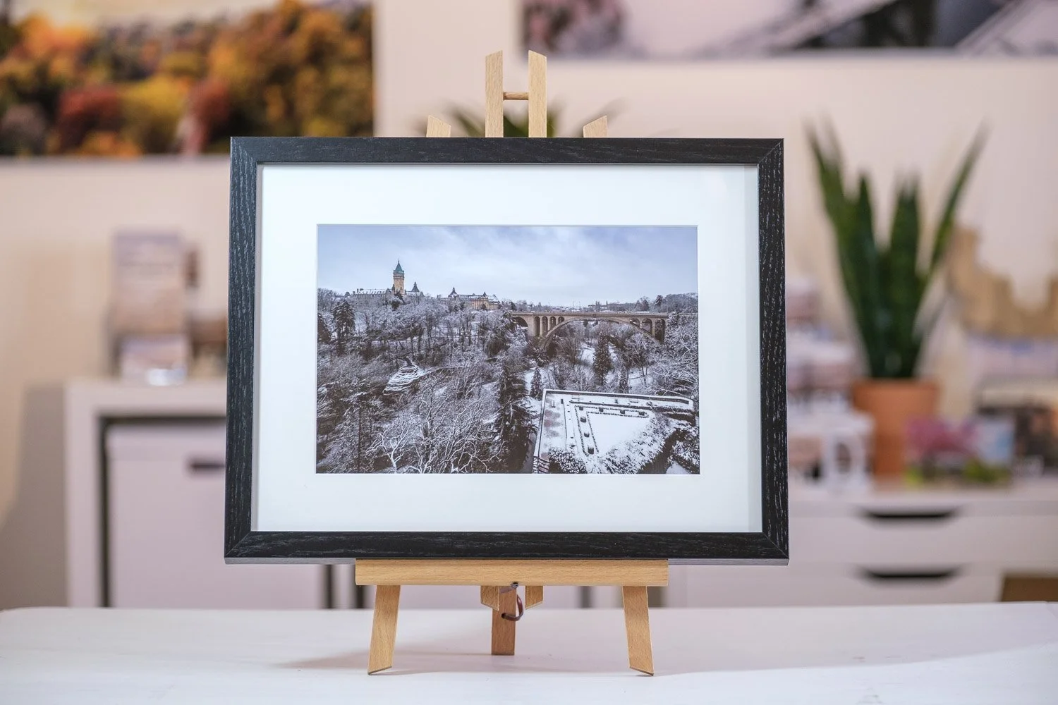 Framed fine art photograph of Luxembourg displayed on a wooden easel