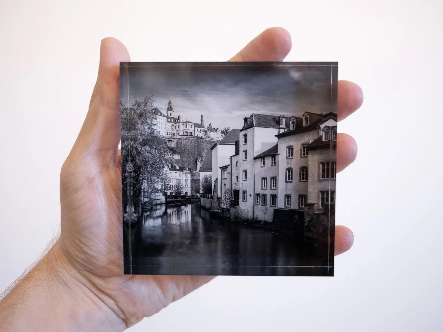 Small acrylic glass block featuring a black and white photograph of Luxembourg City