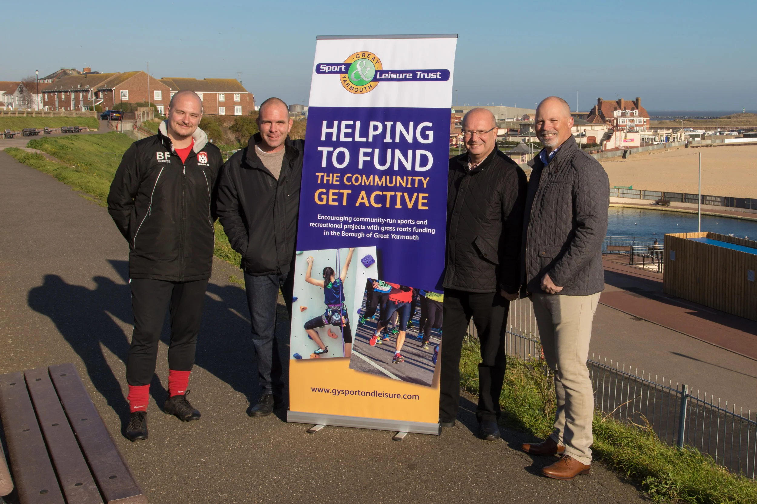 Left to right: Ben Flaxman from Shrublands JFC, Andrew Grant and Graham Plant, board members of Great Yarmouth Sport and Leisure Trust, and Alan Pearce Chairman of Caister Football Club. Photograph by David Woodcock . - Missing is a representative from Revolutionary Roots.