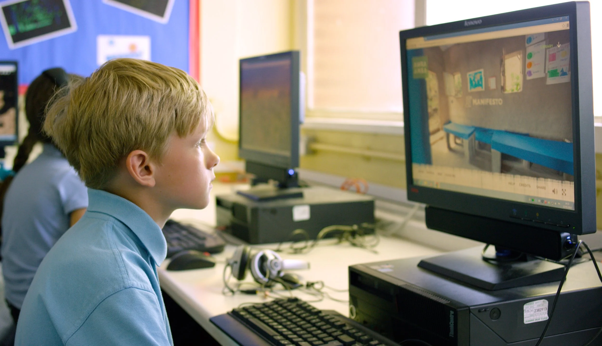 YEAR 5 BOY EXPLORING AWRA AMBA ON A PC