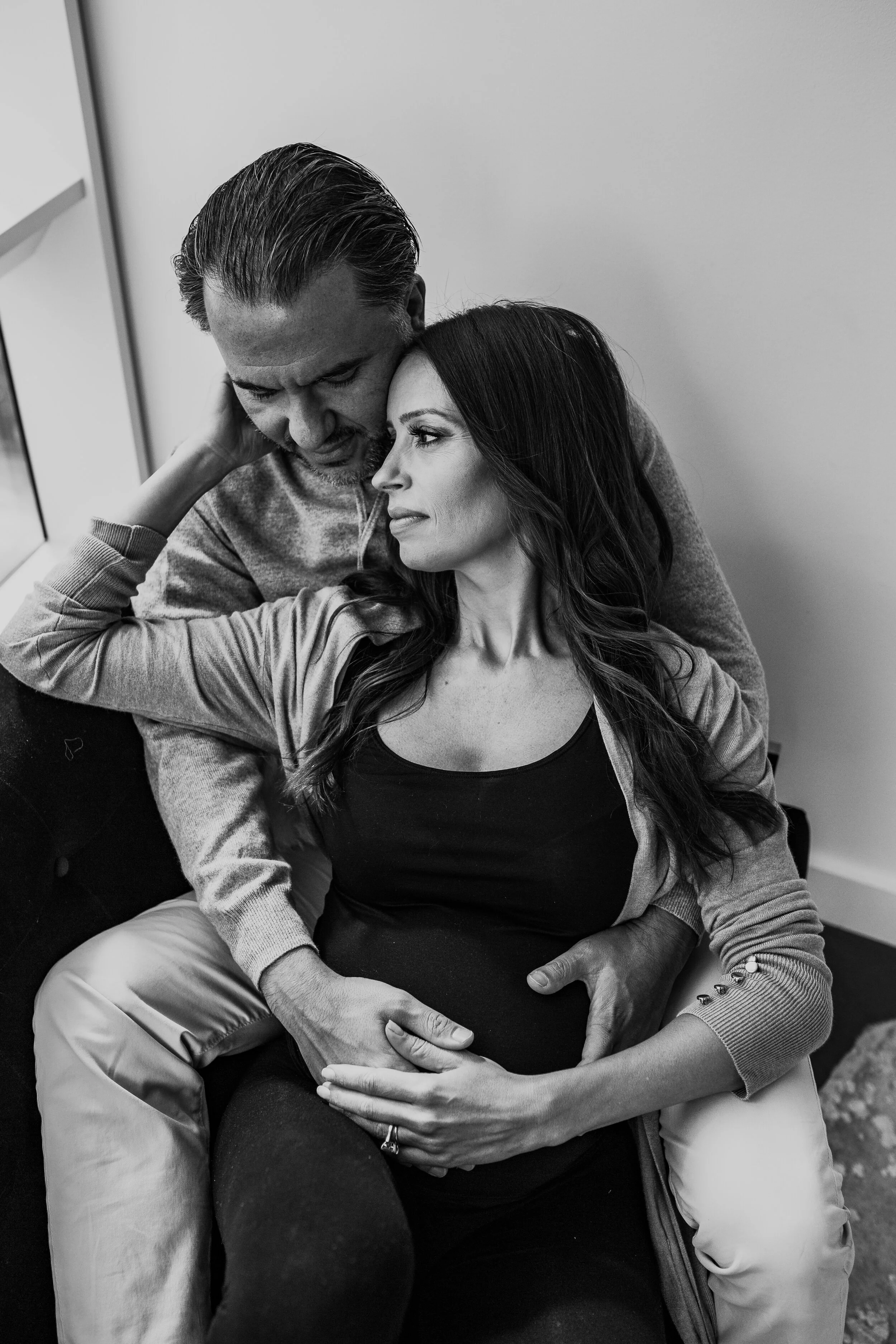 Expecting couple hugging during a maternity session in NYC