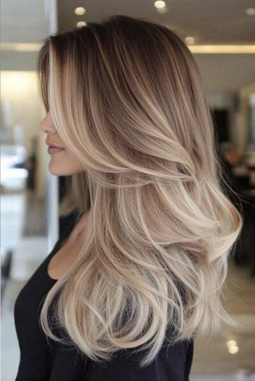 Natural balayage hair color with soft highlights at salon in Sunny Isles Beach