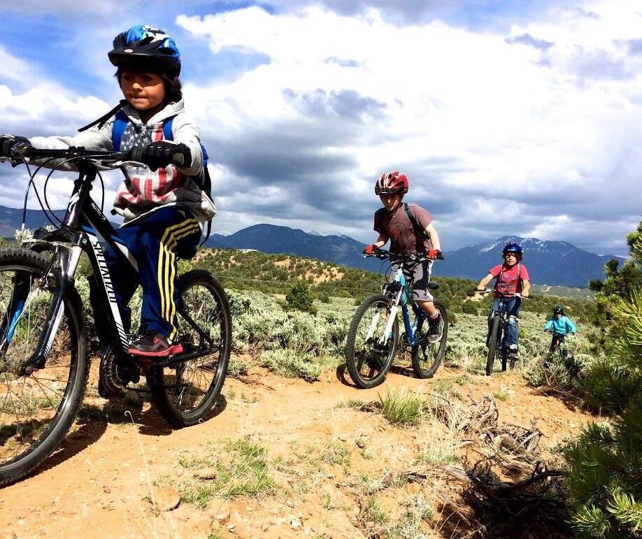Taos-kids-riding-sky.jpeg