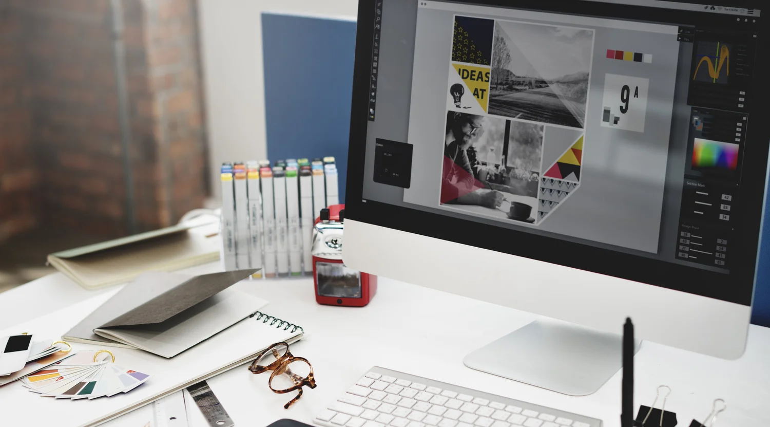 Laptop on a desk showing a marketing graphic designed by Promo Sauce