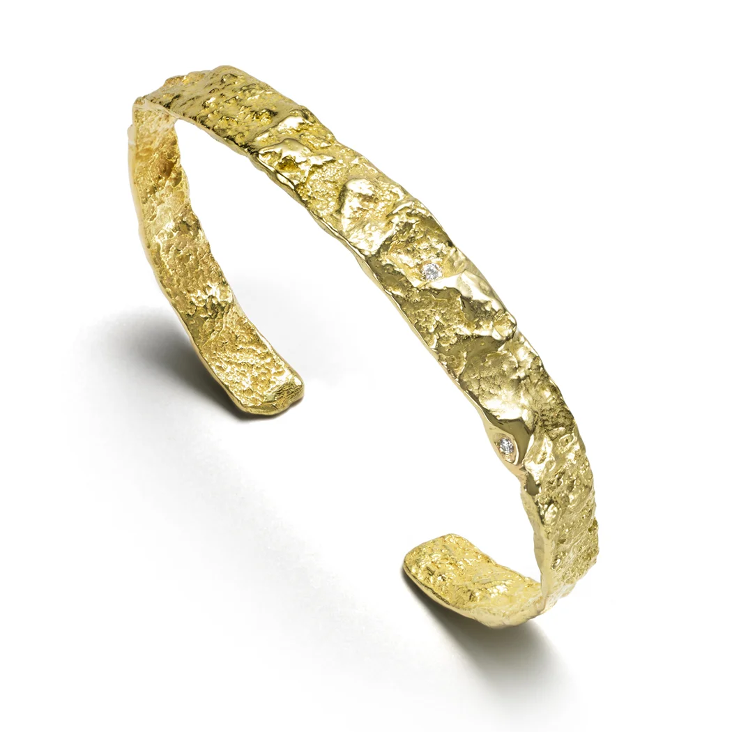 ED93B Burst cuff. 18k yellow gold, white diamonds.