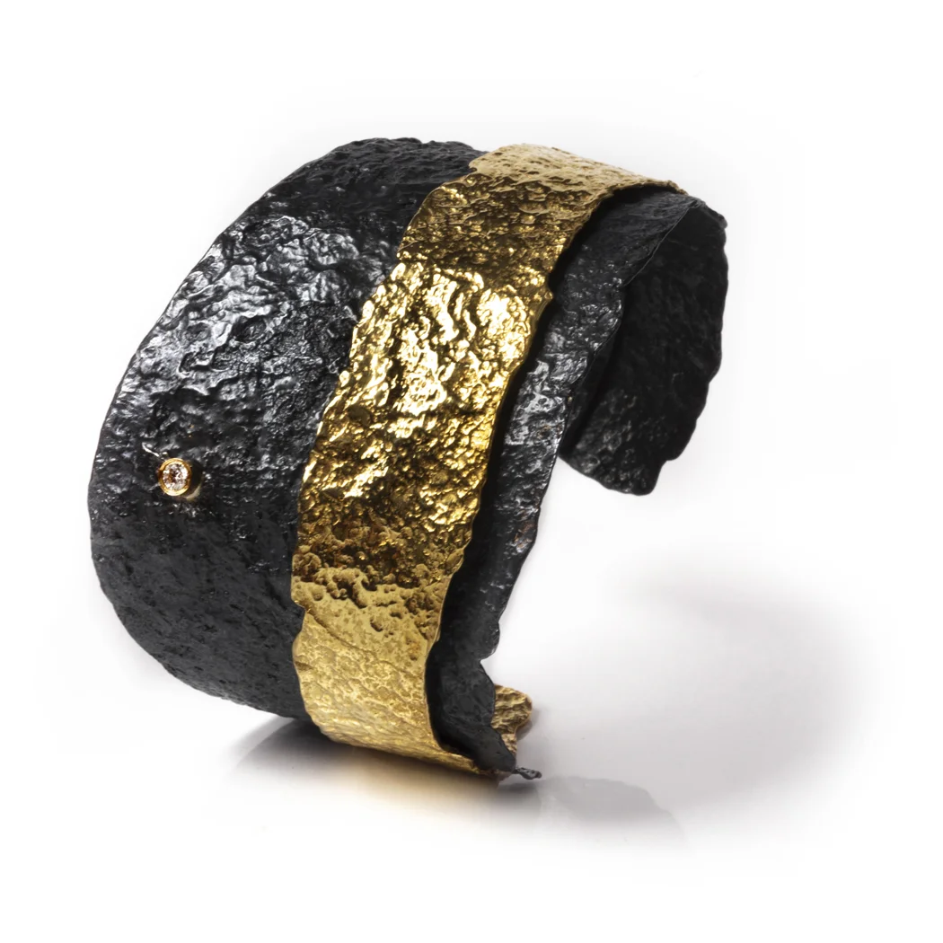 ED124B Letting Go cuff. Blackened sterling silver, 18k yellow gold, white diamond.