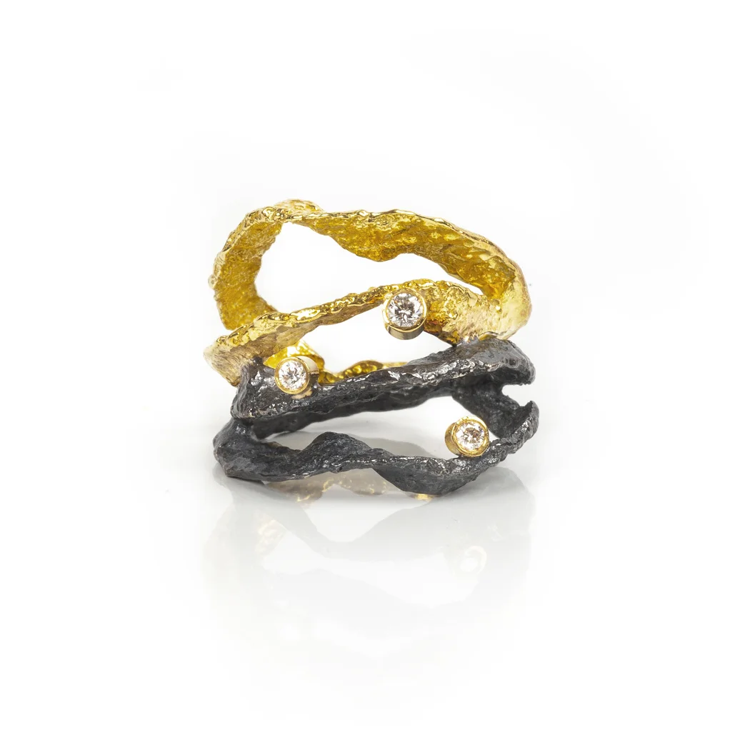 ED118R Letting Go ring. 18k yellow gold, blackened sterling silver, white diamonds.