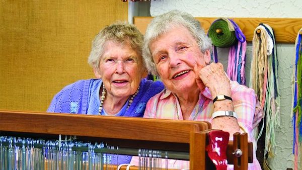 A recent photo of my grandma, age 99, featured in her local paper, along with her long-time friend and fellow 99-year-old, as they reflect on their time as "Grand Weavers" at the Tryon Arts and Crafts School. Photo: Tryon Daily Bulletin.