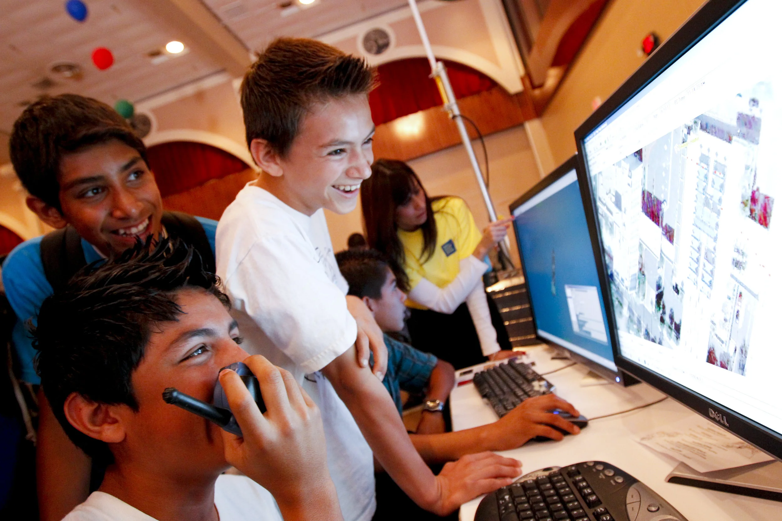 A high quality sample image exemplifying engaged youth from diverse backgrounds interacting and having fun.
