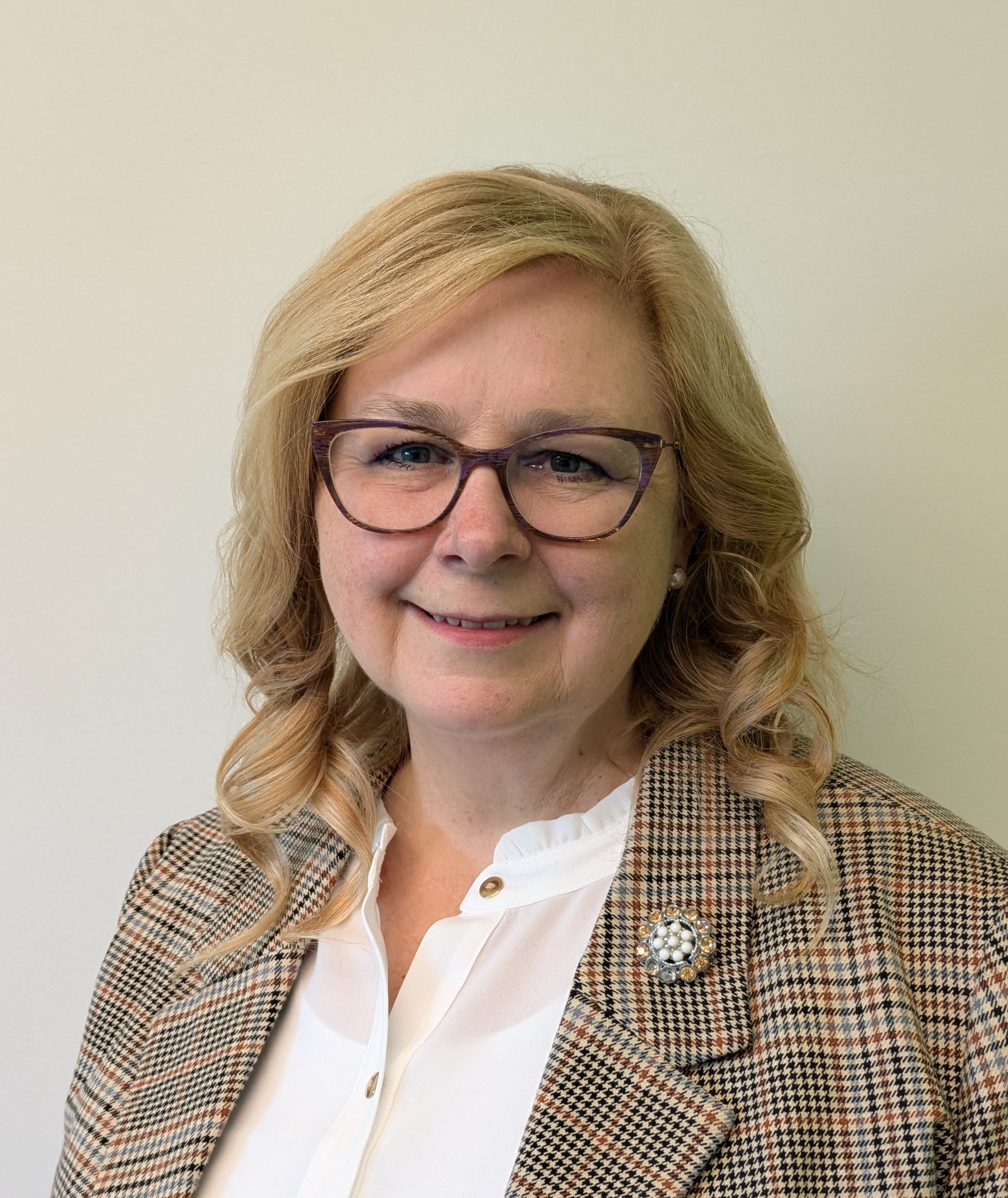 Smiling blonde woman with glasses