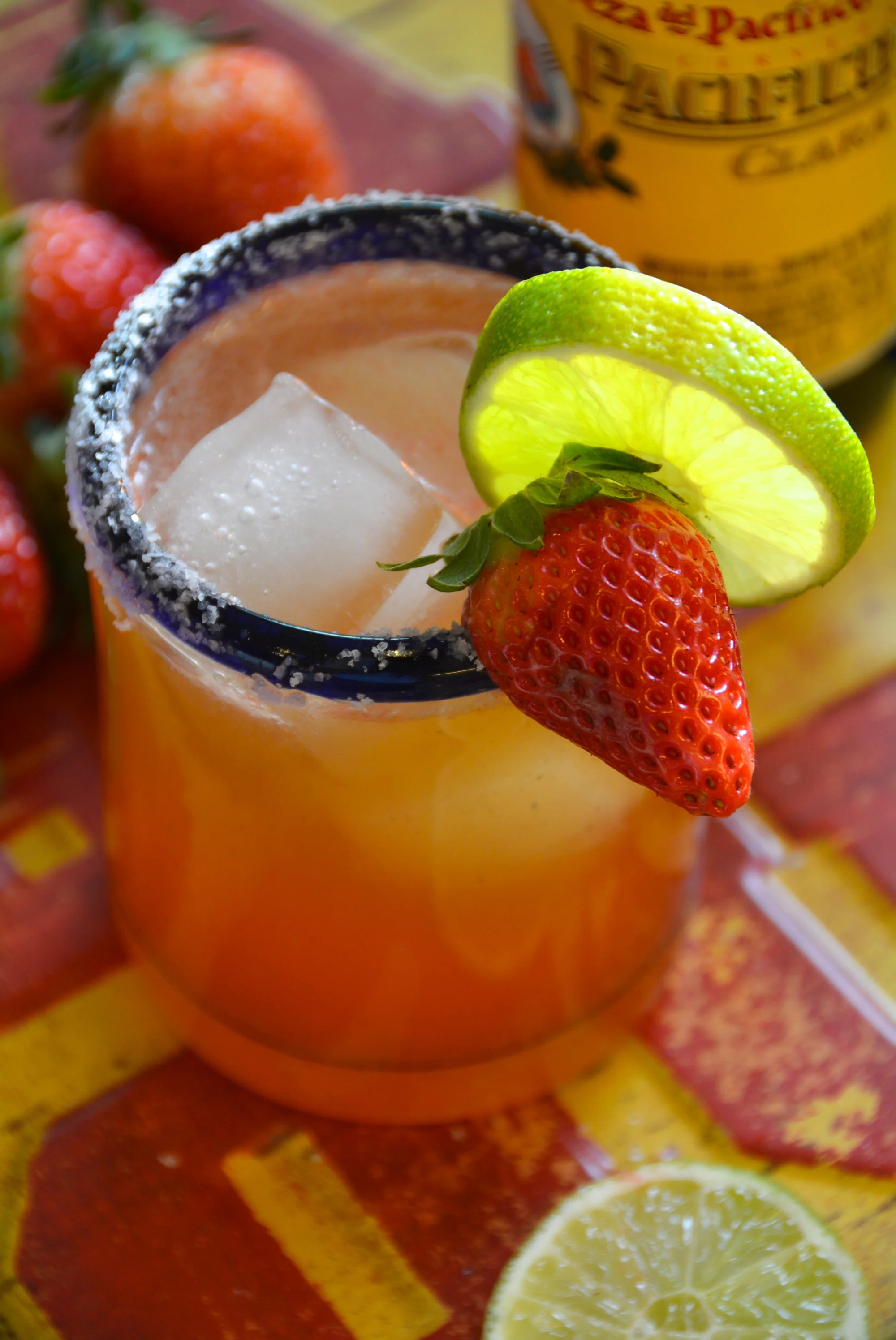 Beer Margarita with a strawberry lime garnish