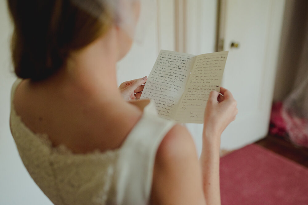 strong-mansion-wedding-bride-reading-letter-by-Gabriele-Stonyte-Photography
