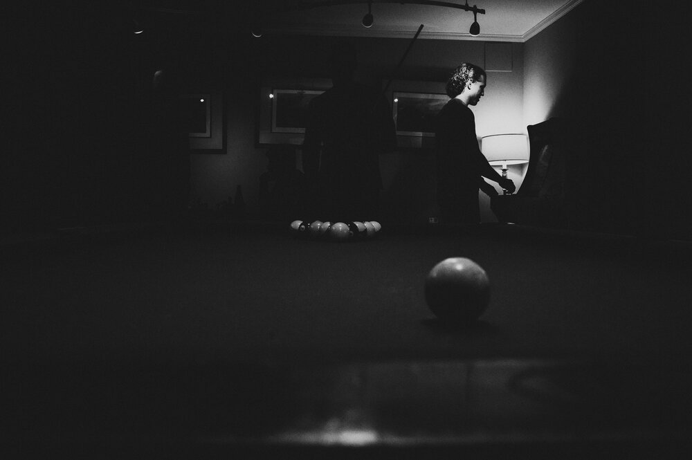 airlie-warrenton-wedding-groomsmen-playing-pool-picture-by-Gabriele-Stonyte-Photography