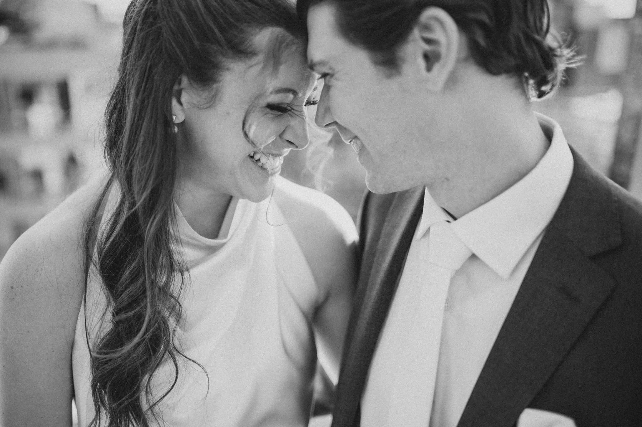 Bride and groom smiling forehead to forehead at their Jewish wedding at HQO Events in Navy Yard, Washington, D.C., photographed by Gabriele Stonyte Photography