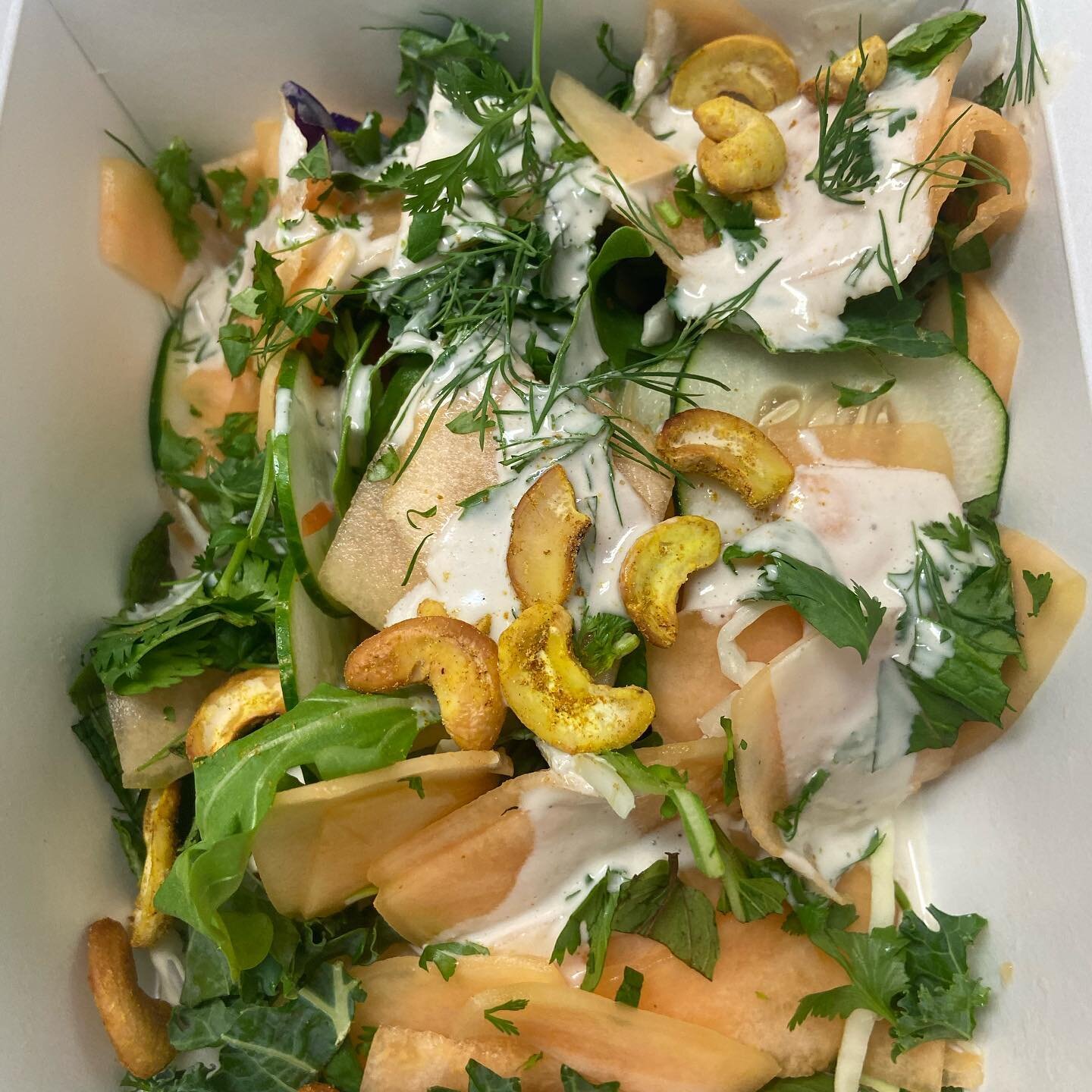 Cantaloupe salad with curry cashew, cooling cucumber, and loads fresh herbs