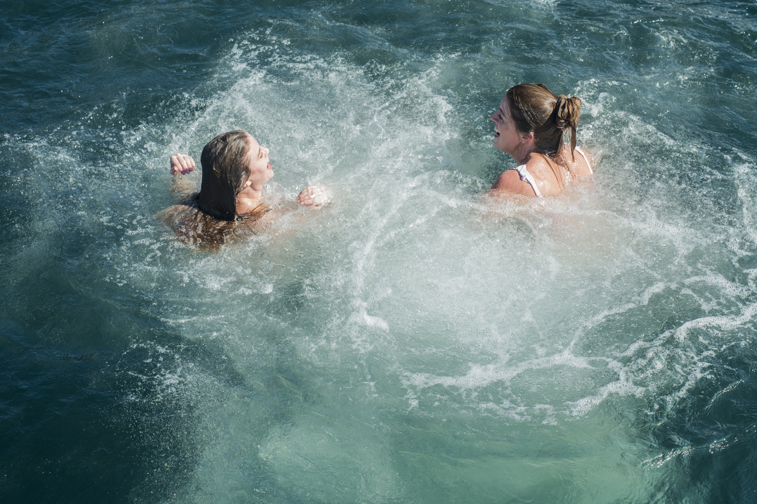 splish splash, jumping off the sailboat into the bay