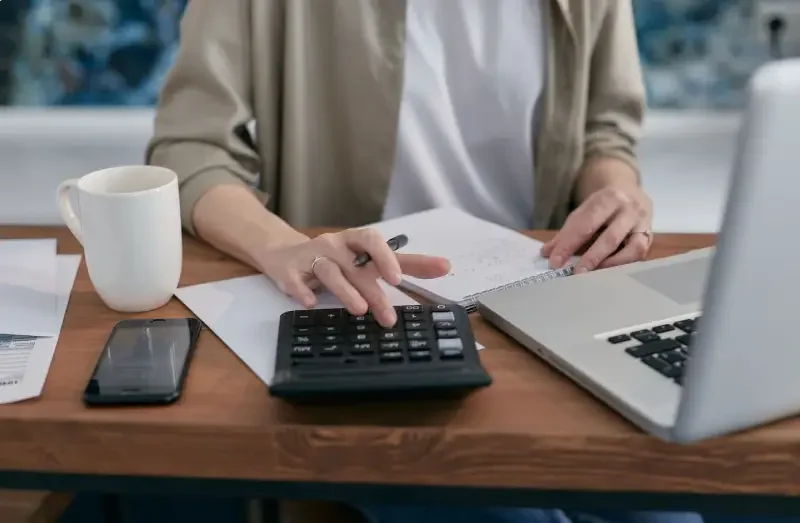 Mortgage broker calculating budget and debt planning