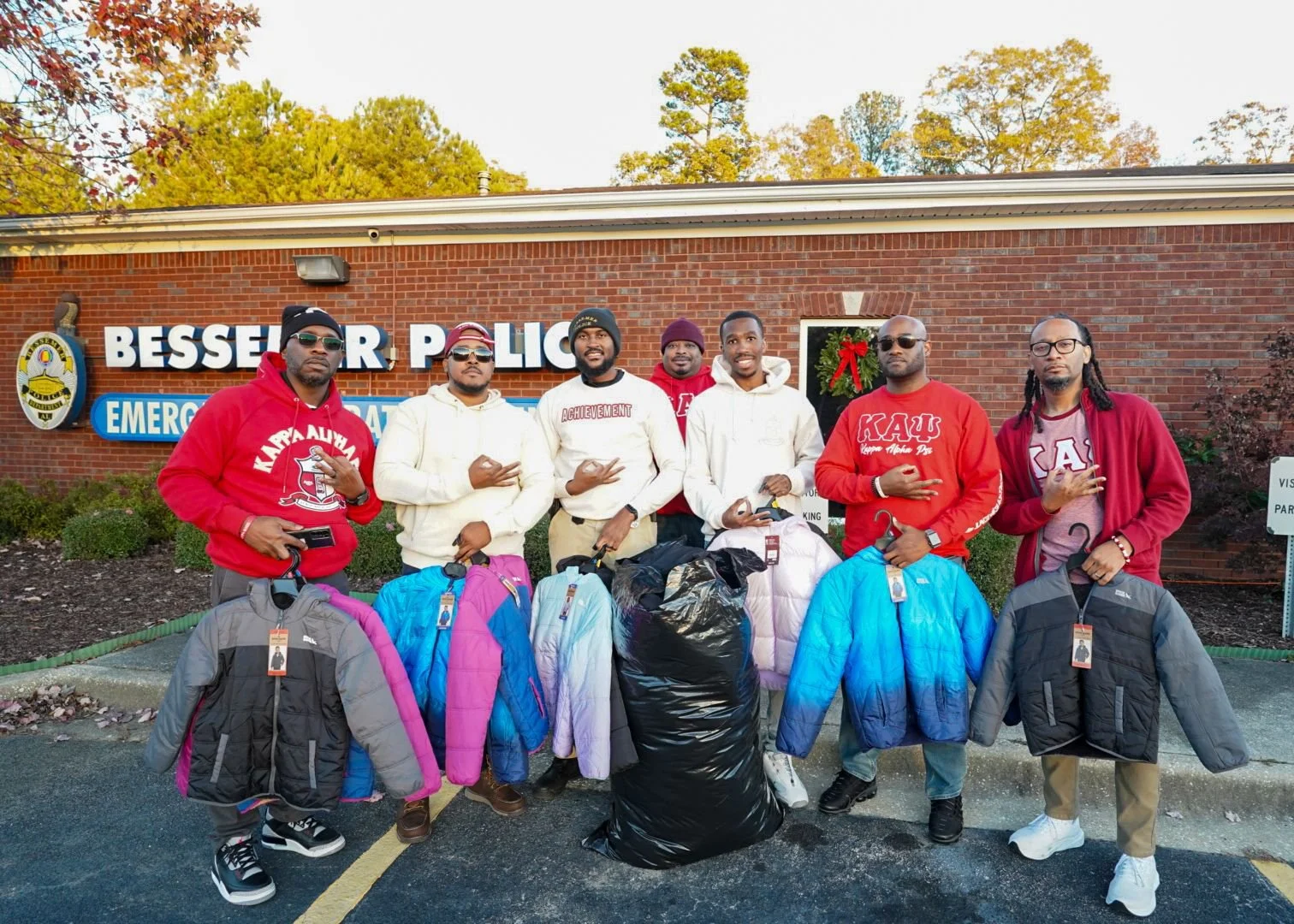 Fall 2024 initiates donating kids coats to Bessemer Police Department