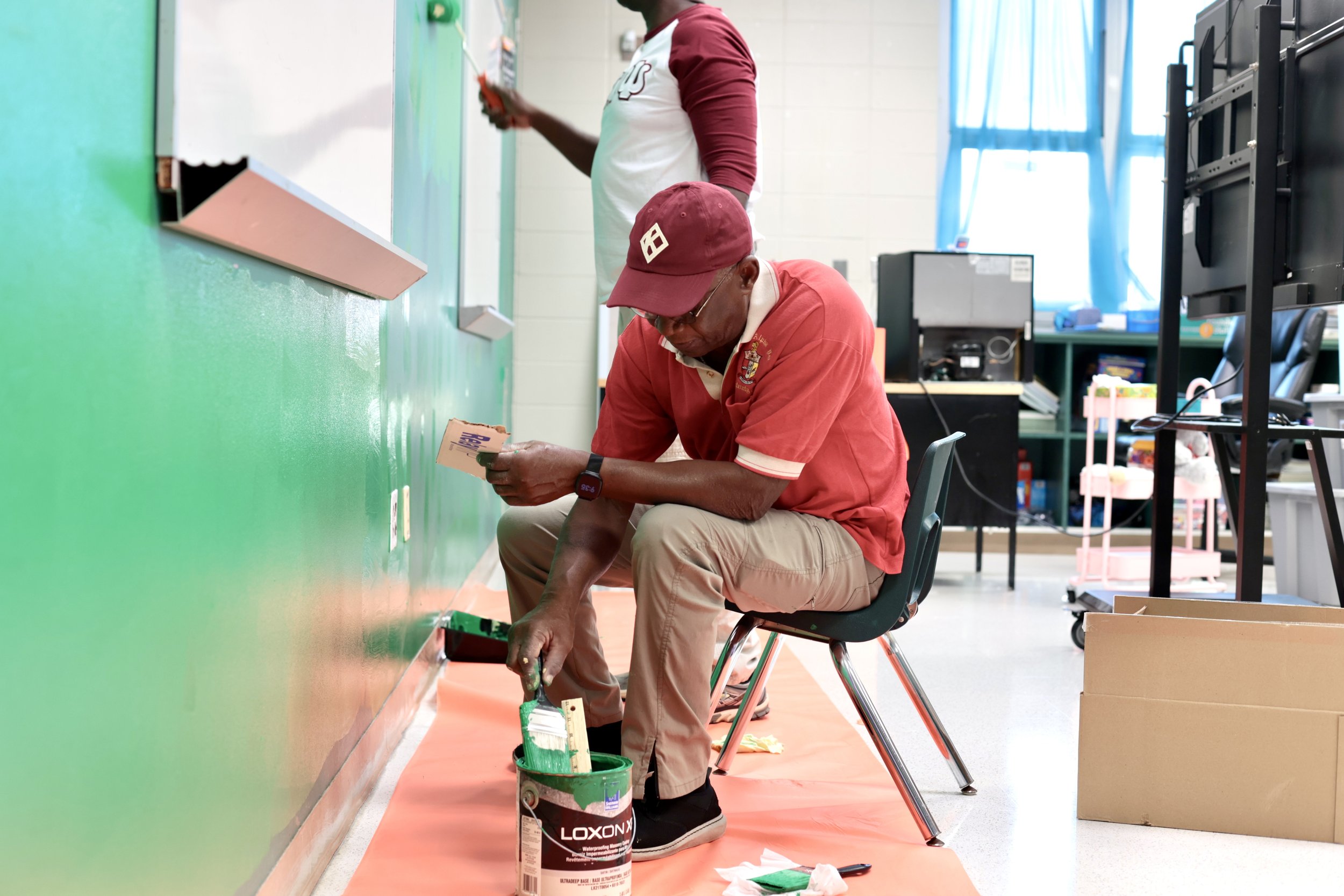 Birmingham Alumni Brothers painting during Booker T.  Washington Middle school clean up project