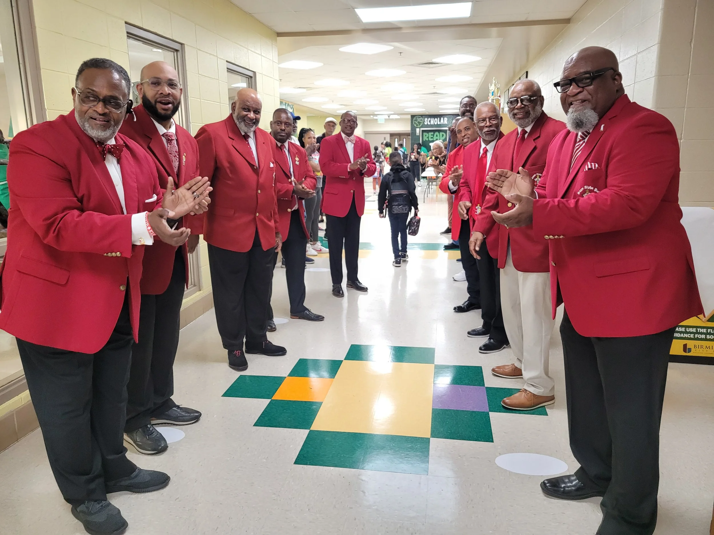 Kappa Brothers from the Birmingham Alumni Chapter welcoming Booker T. Washington students on their first day of school.