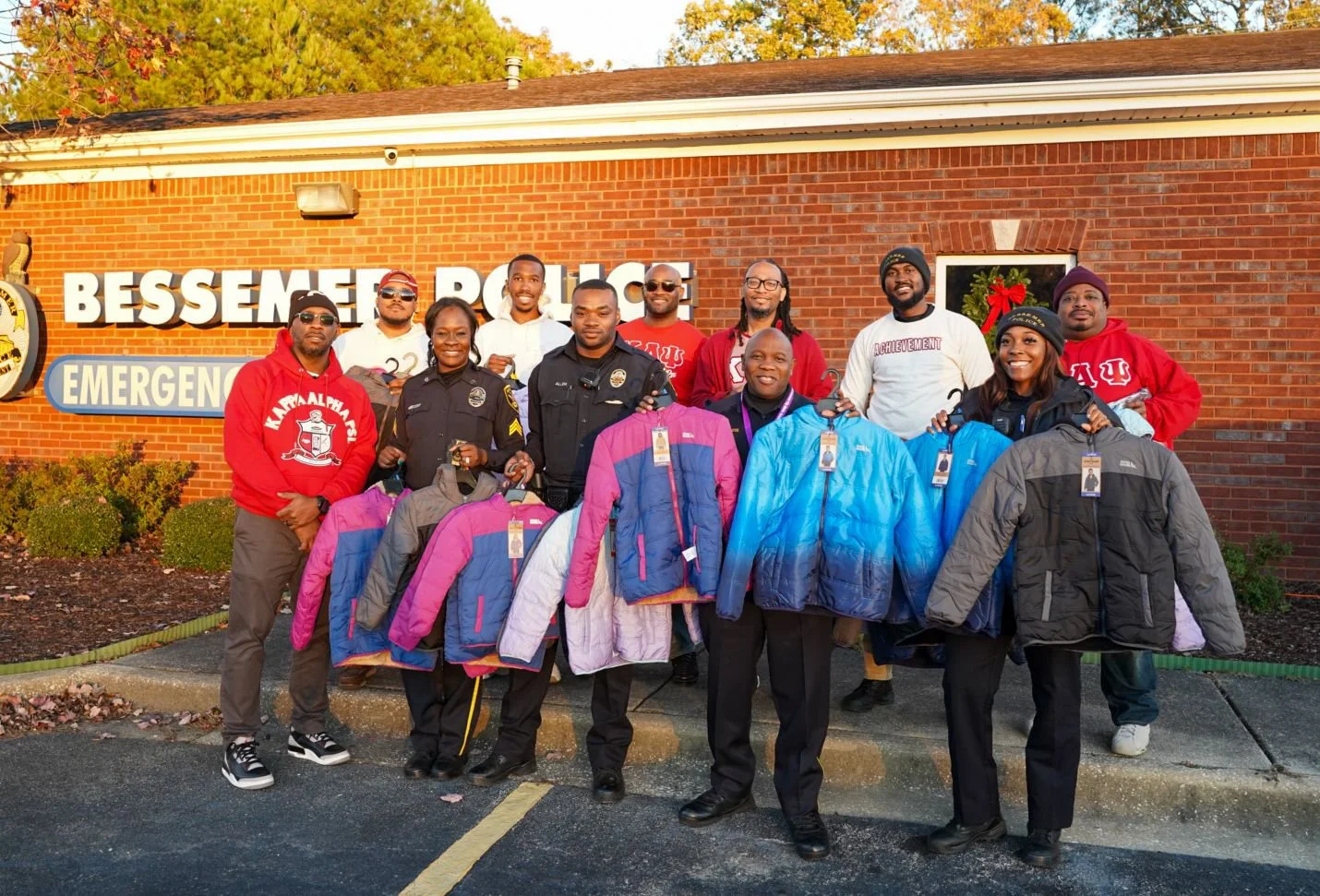 Fall 2024 initiates donating kids coats to Bessemer Police Department
