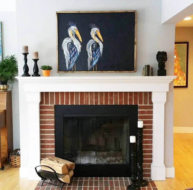 blue heron artwork, brick and white fireplace (Copy)
