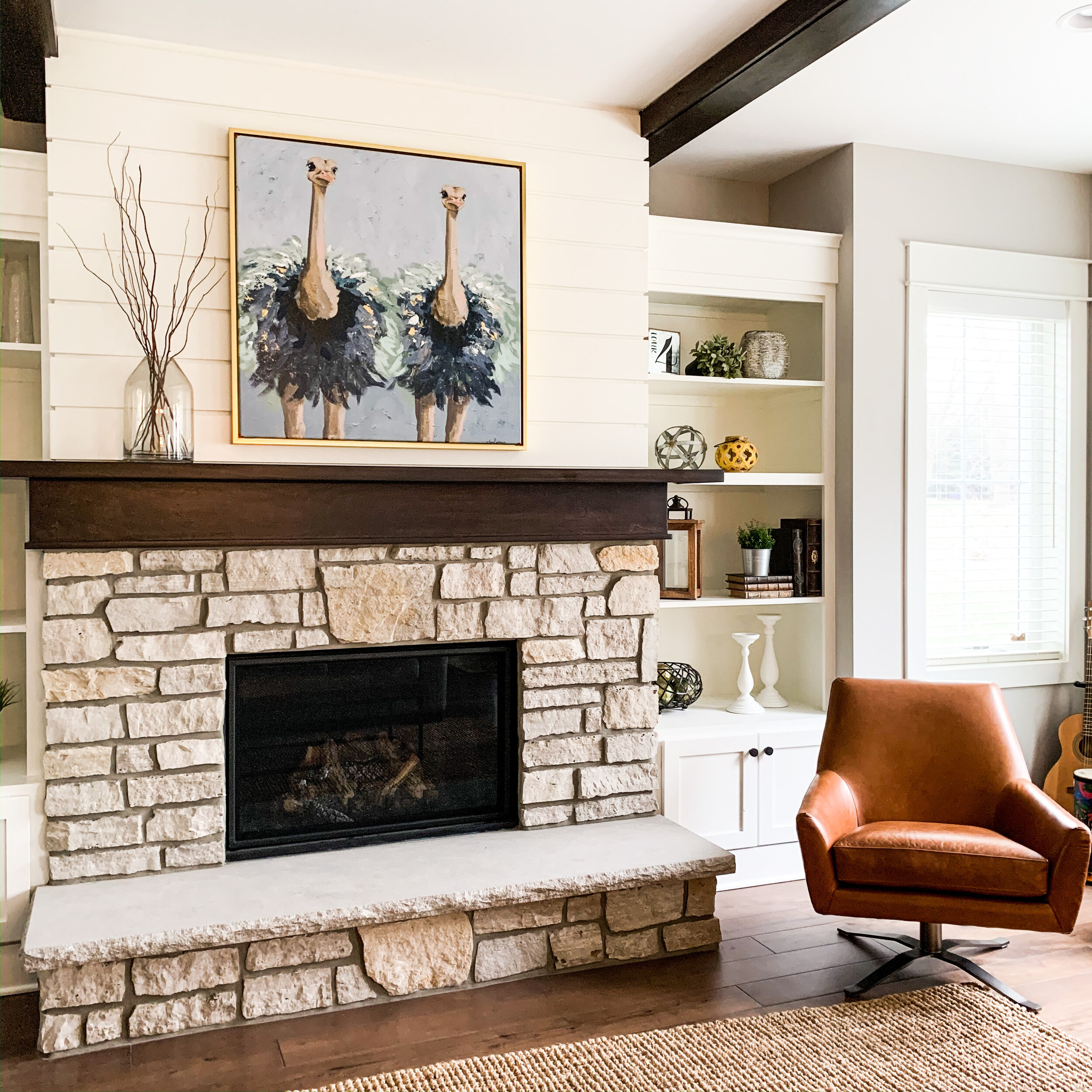 stone fireplace, ostrich artwork