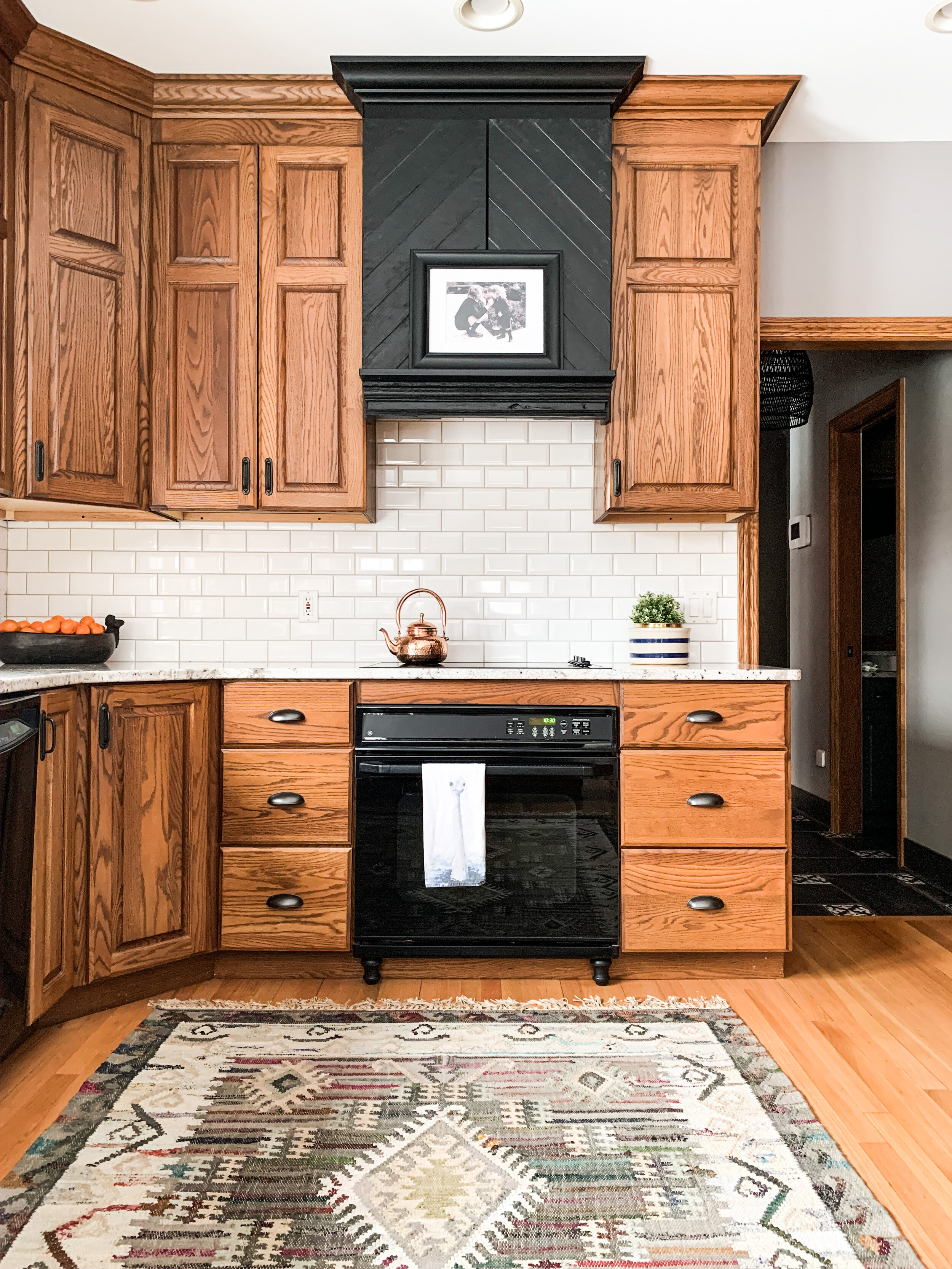 How To Make An Oak Kitchen Cool Again Copper Corners Here are the cabinets after they were painted. how to make an oak kitchen cool again