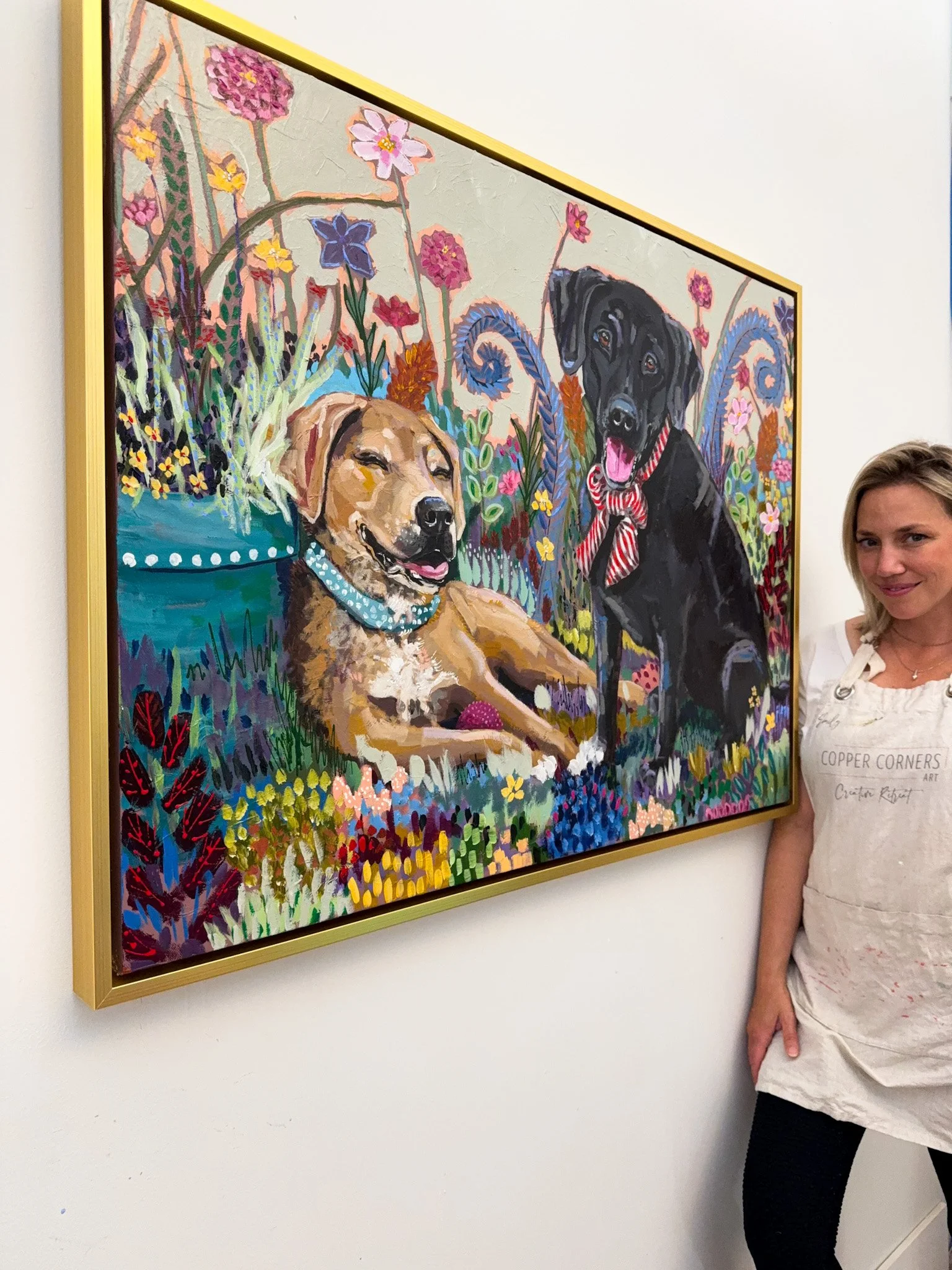 dog artist, painting of two dogs, black lab, playing in garden of flowers