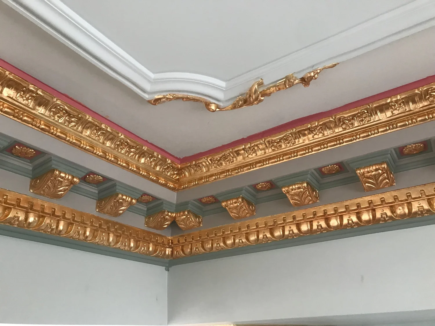 Gilded plaster cornice with ornament