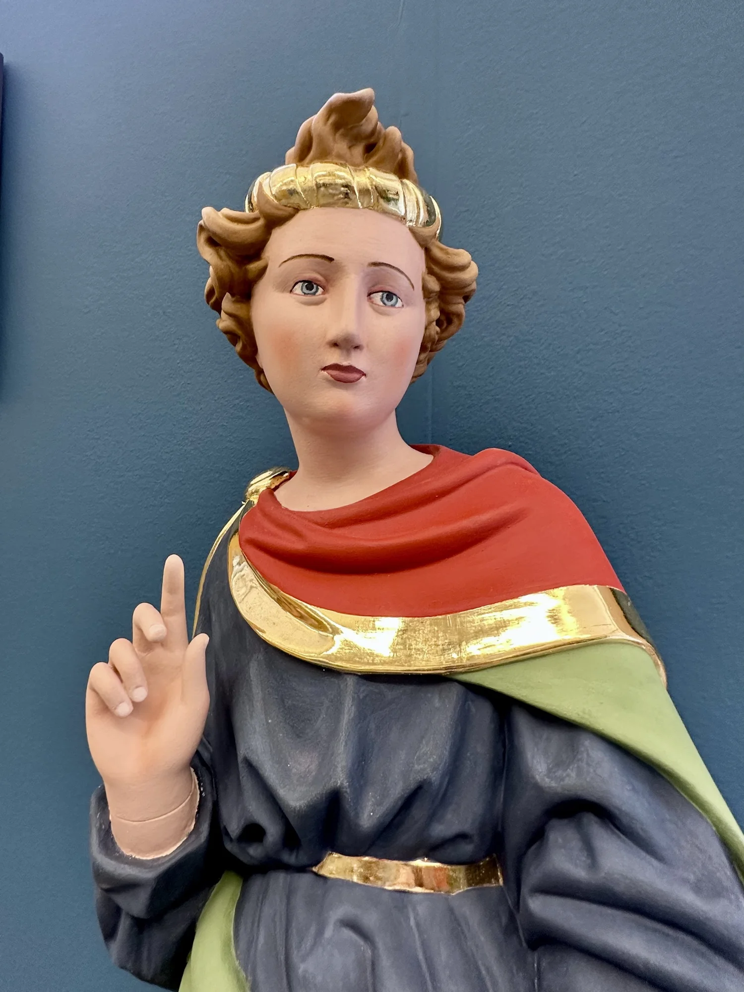 Restored polychrome church statue with gilded details