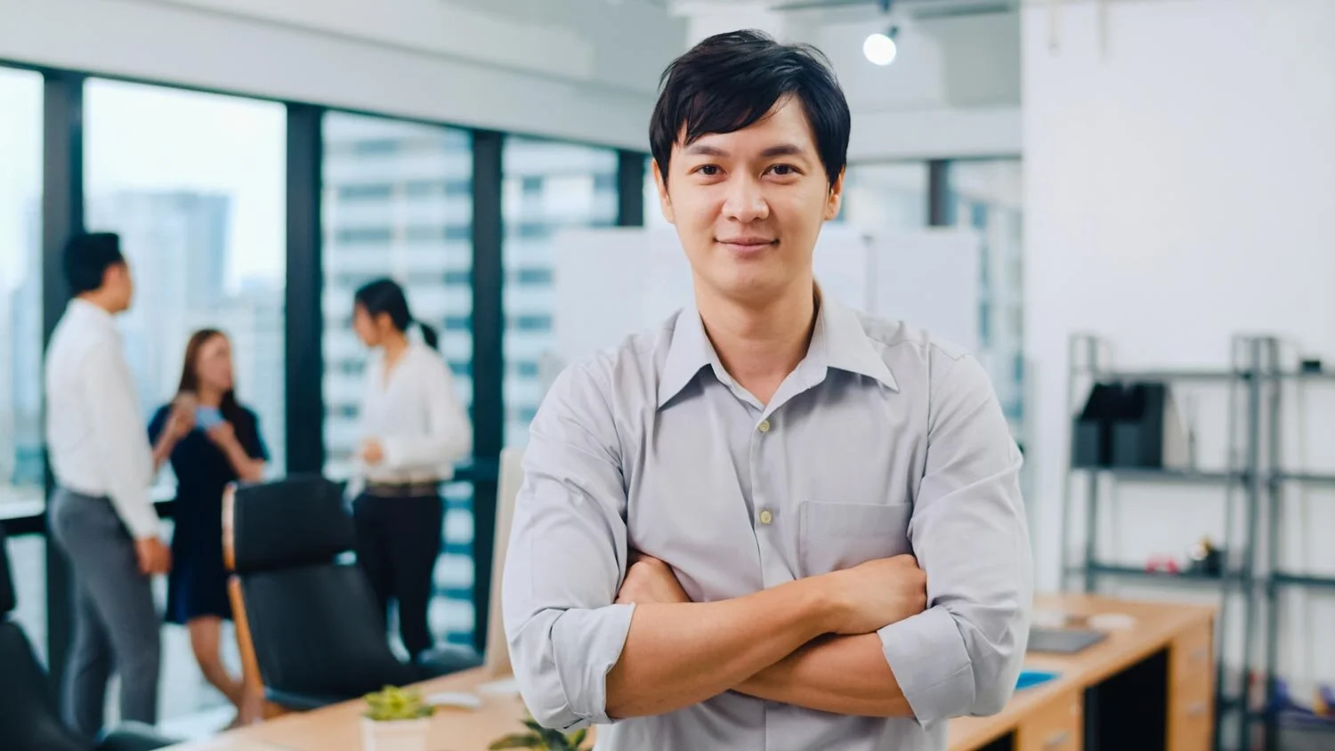 portrait-successful-handsome-executive-businessman-smart-casual-wear-looking-camera-smiling-arms-crossed-modern-office-workplace-young-asia-guy-standing-contemporary-meeting-room.jpg