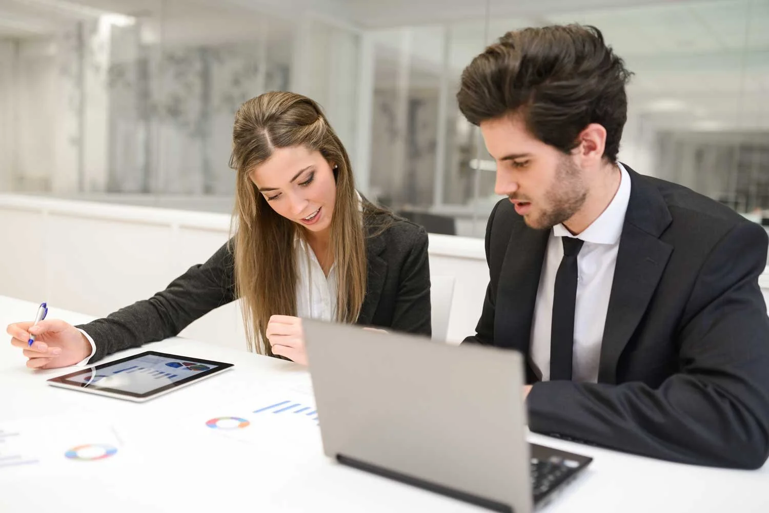 employees-reviewing-financial-report.jpg