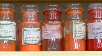 Various vermilion pigment jars at Zecchi in Florence.
