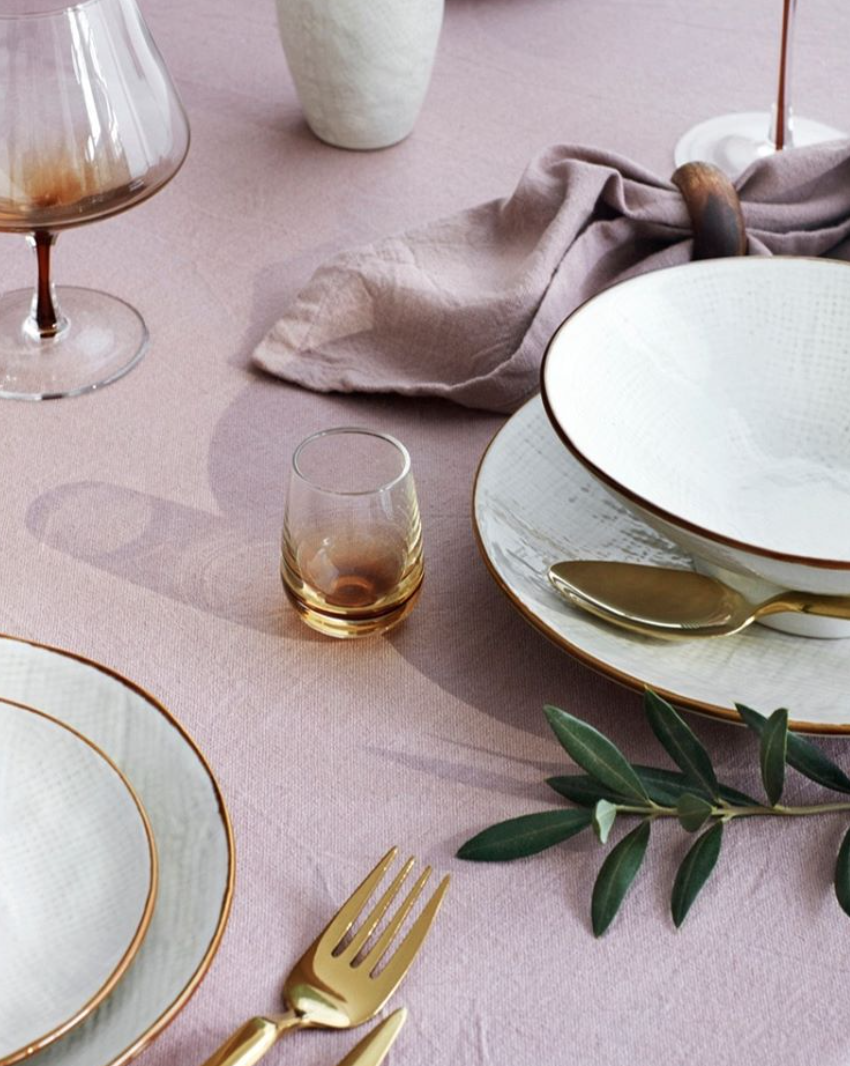   Cutlery Tvis Rose Gold ,  Shots Glass Amber ,  Dinner Plate Nordic Sand ,  Bowl Nordic Sand , and  Cognac Glass Amber  all created by  Broste Copenhagen .  