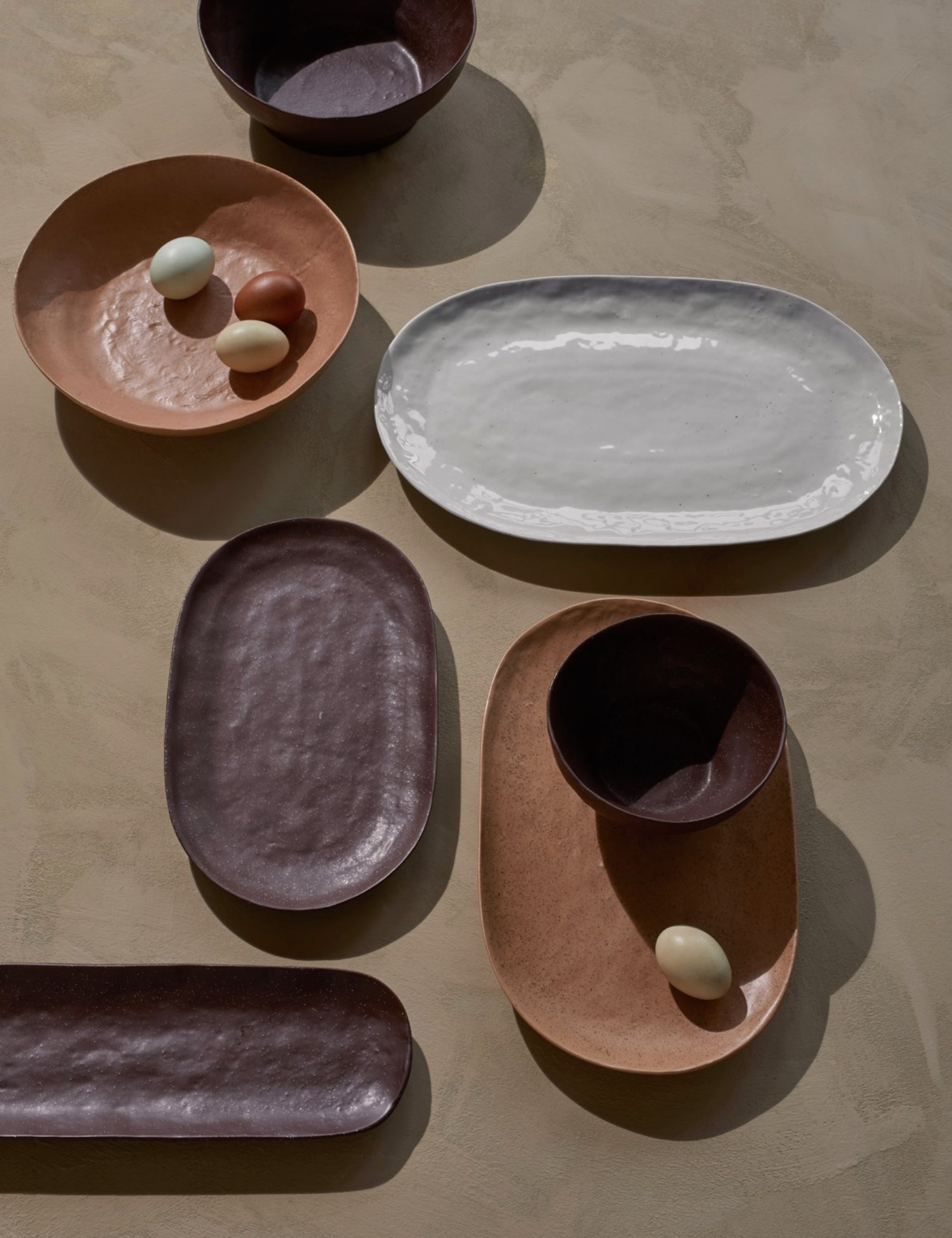   Plate Shape Porcelain Grey ,  Plate Shape Porcelain Brown,   Plate Shape Porcelain Camel ,  Bowl Shape Porcelain Brown ,  Bowl Shape Porcelain Camel  all created by  Broste Copenhagen.   