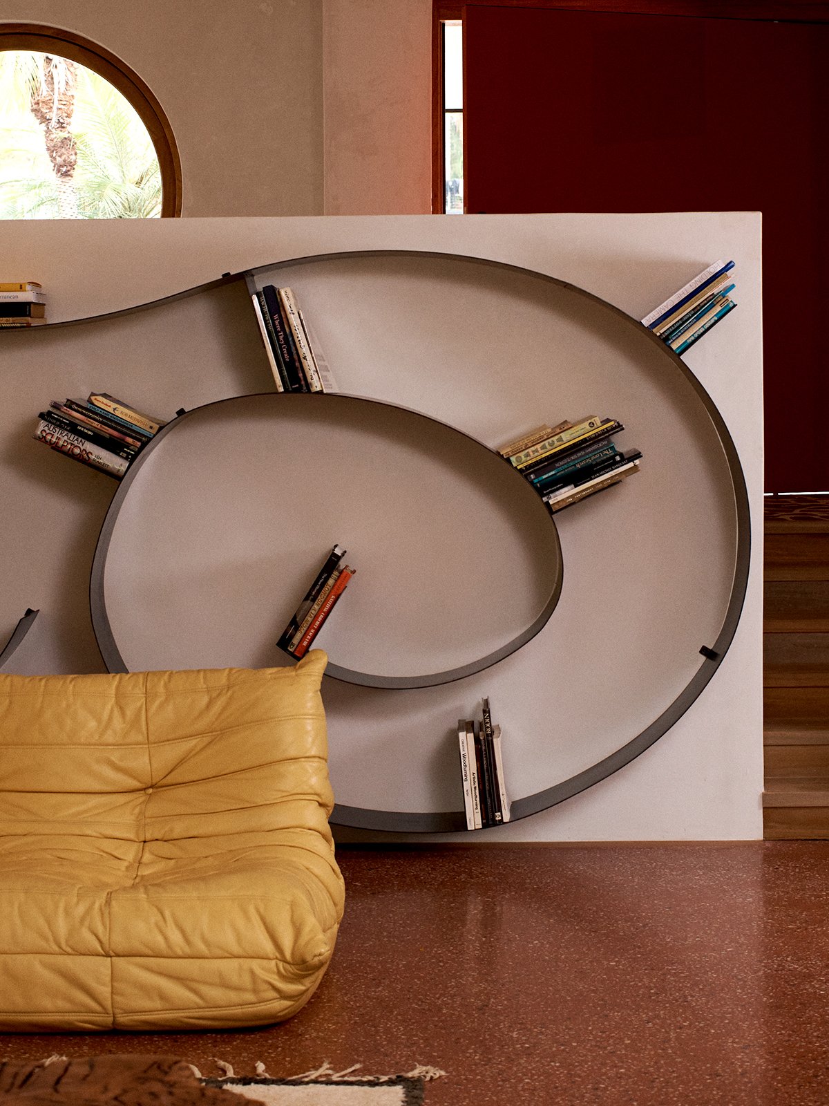Library-at-The-Sunseeker-Byron-Bay-Eastern-Forge-spiral-bookshelf-Tigmi-Togo-sofa-photo-credit.-James-Tolic.jpg