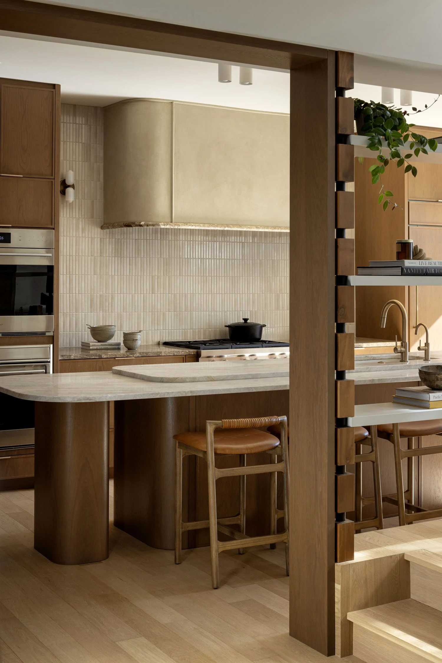 calgary-home-mera-studio-architects-brass-sconces-leather-counter-stools