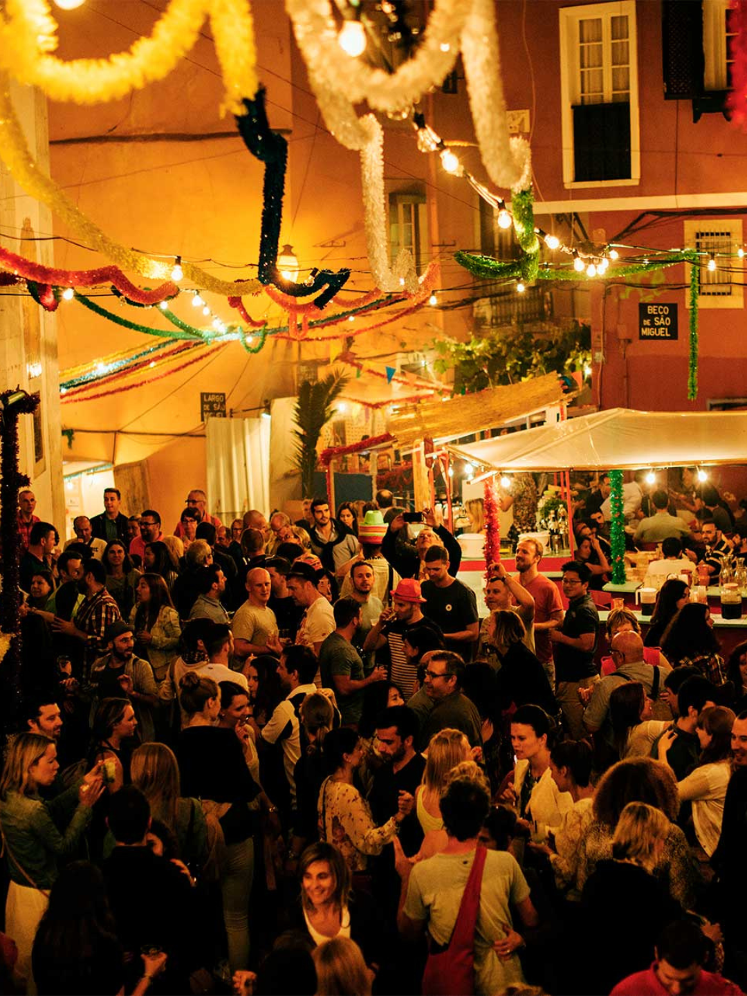 Street celebrations during Santos Populares in Lisbon, with sardines on the grill and festive decorations across the city's neighbourhoods throughout June.