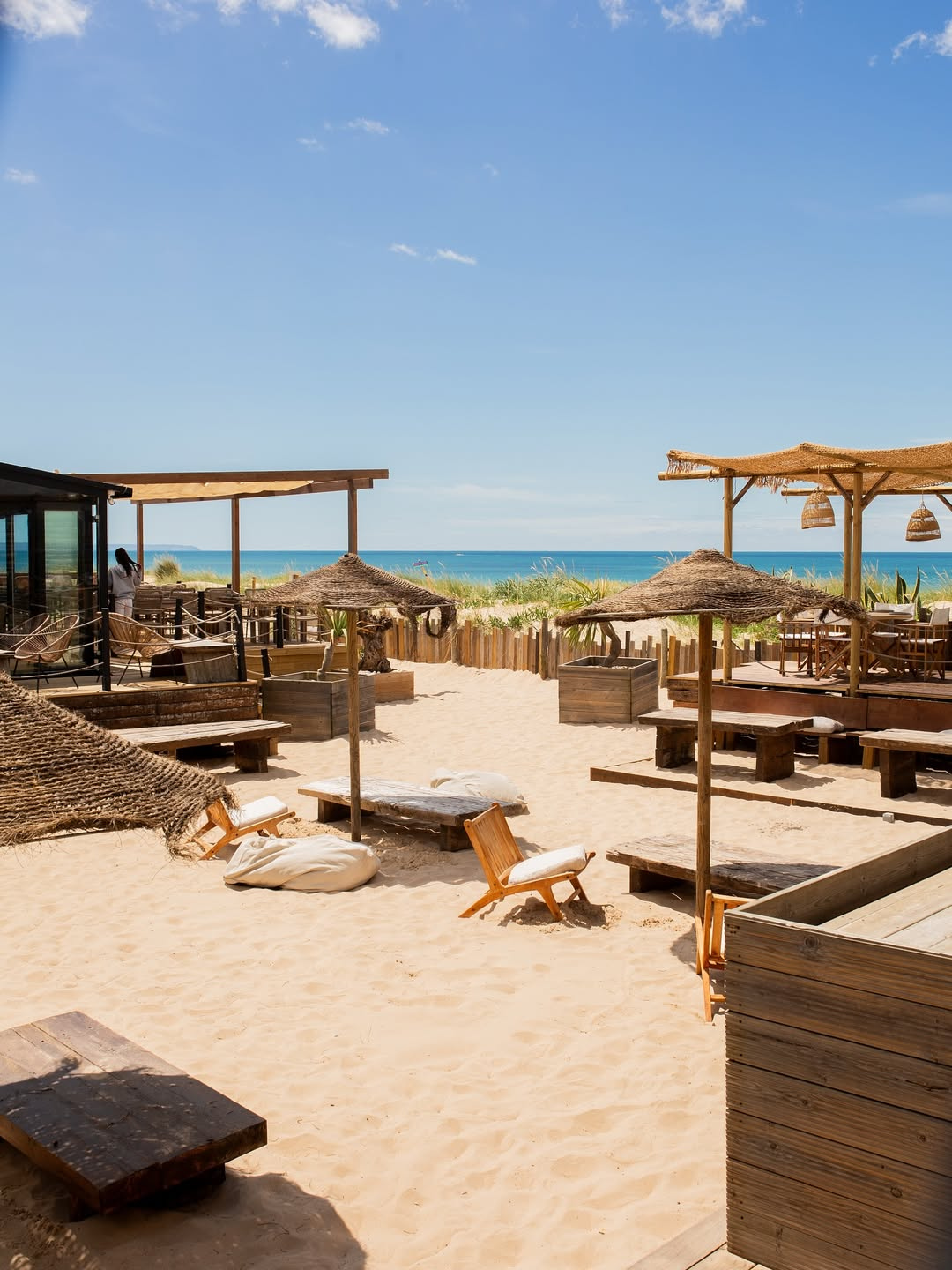 The terrace at Lorosae Sol Nascente on Praia de São João, Costa da Caparica, with Atlantic ocean views, petiscos and sangria on a sunny day.