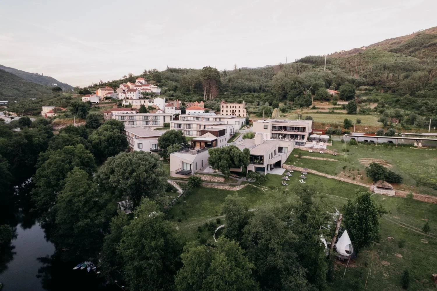 Aqua Village architecture blending with forest and natural landscape