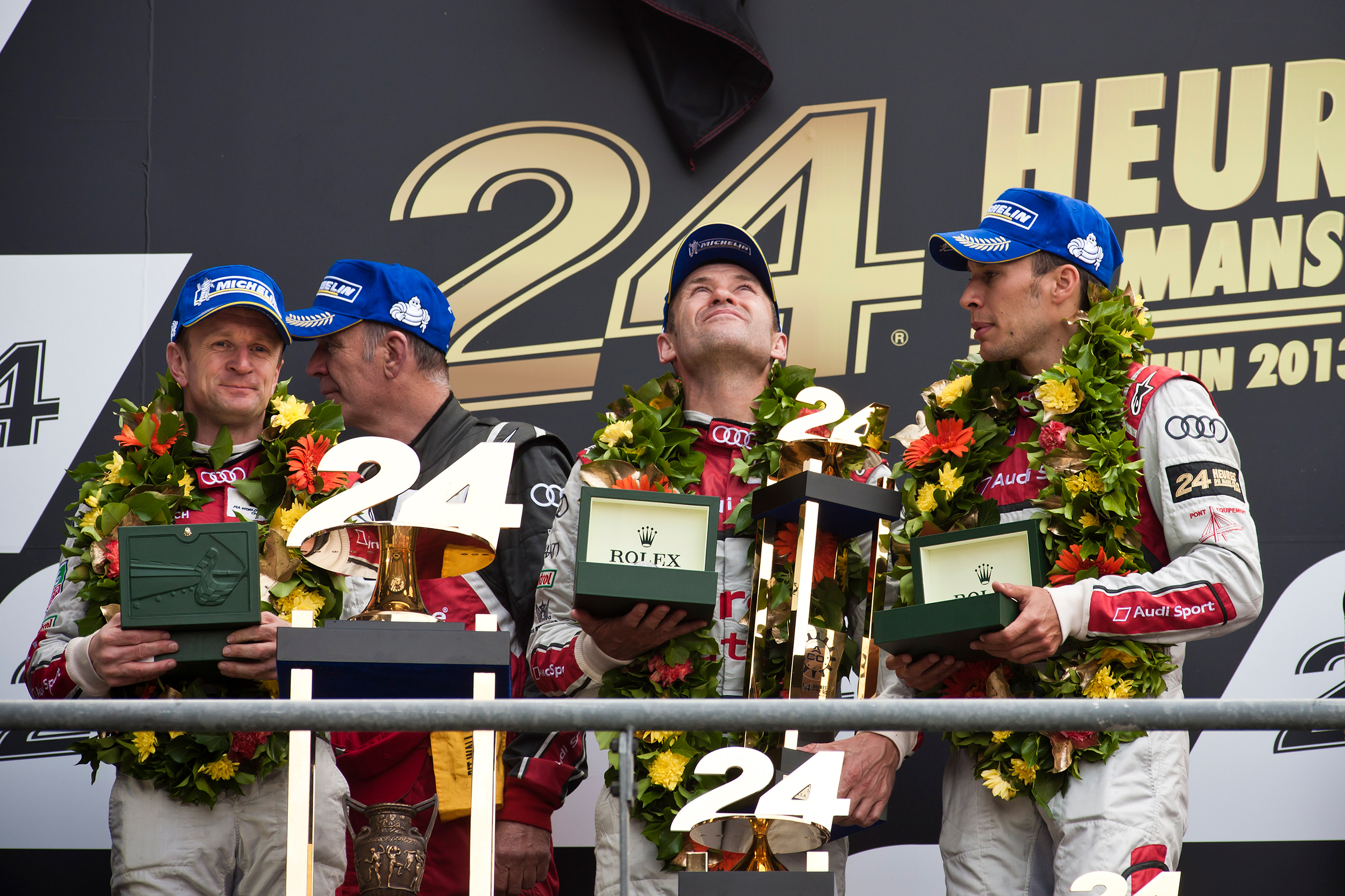 Allan McNish, Tom Kristensen, Loic Duval and Dr Wolfgang Ullrich on the podium